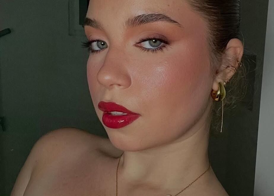 Elegant makeup by Makeup by Yageiry in Jarabacoa, La Vega Province, DO showcasing bold red lips.