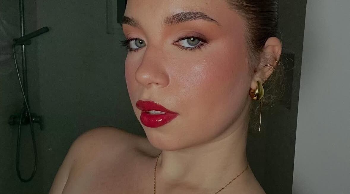 Elegant makeup by Makeup by Yageiry in Jarabacoa, La Vega Province, DO showcasing bold red lips.
