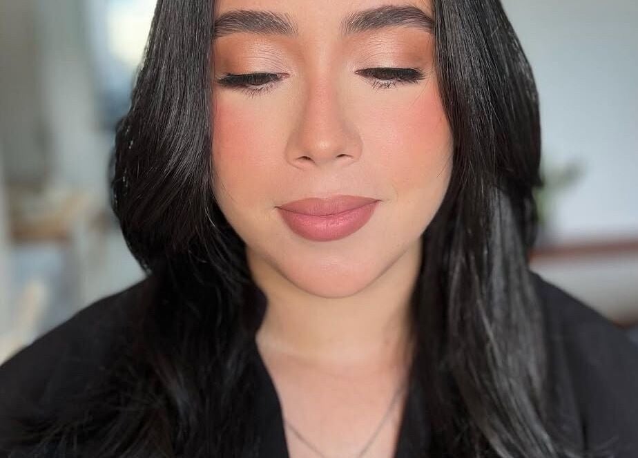 Close-up of a serene face with flawless makeup by Yageiry in Jarabacoa, La Vega Province, DO.