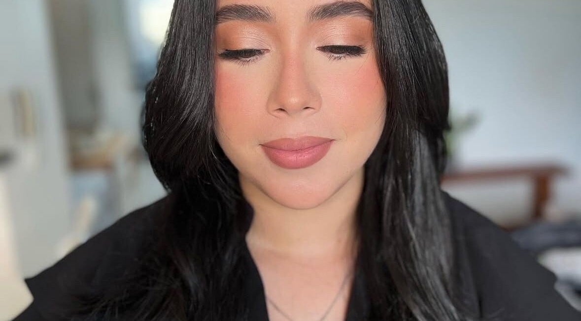 Close-up of a serene face with flawless makeup by Yageiry in Jarabacoa, La Vega Province, DO.