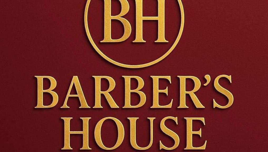 Elegant Barber's House VIP logo in gold on rich maroon, Bogotá, D.C., CO.