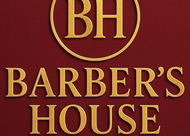 Elegant Barber's House VIP logo in gold on rich maroon, Bogotá, D.C., CO.