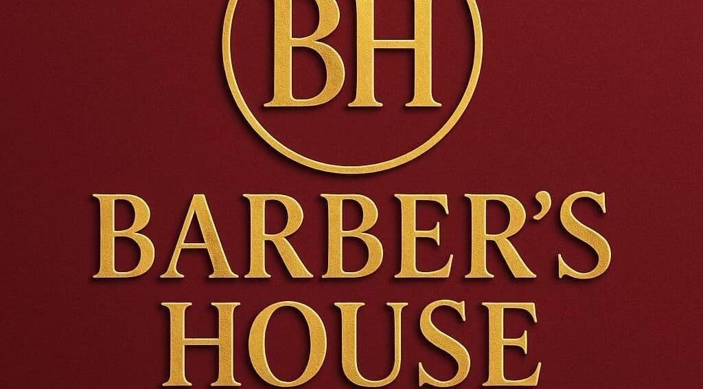 Elegant Barber's House VIP logo in gold on rich maroon, Bogotá, D.C., CO.