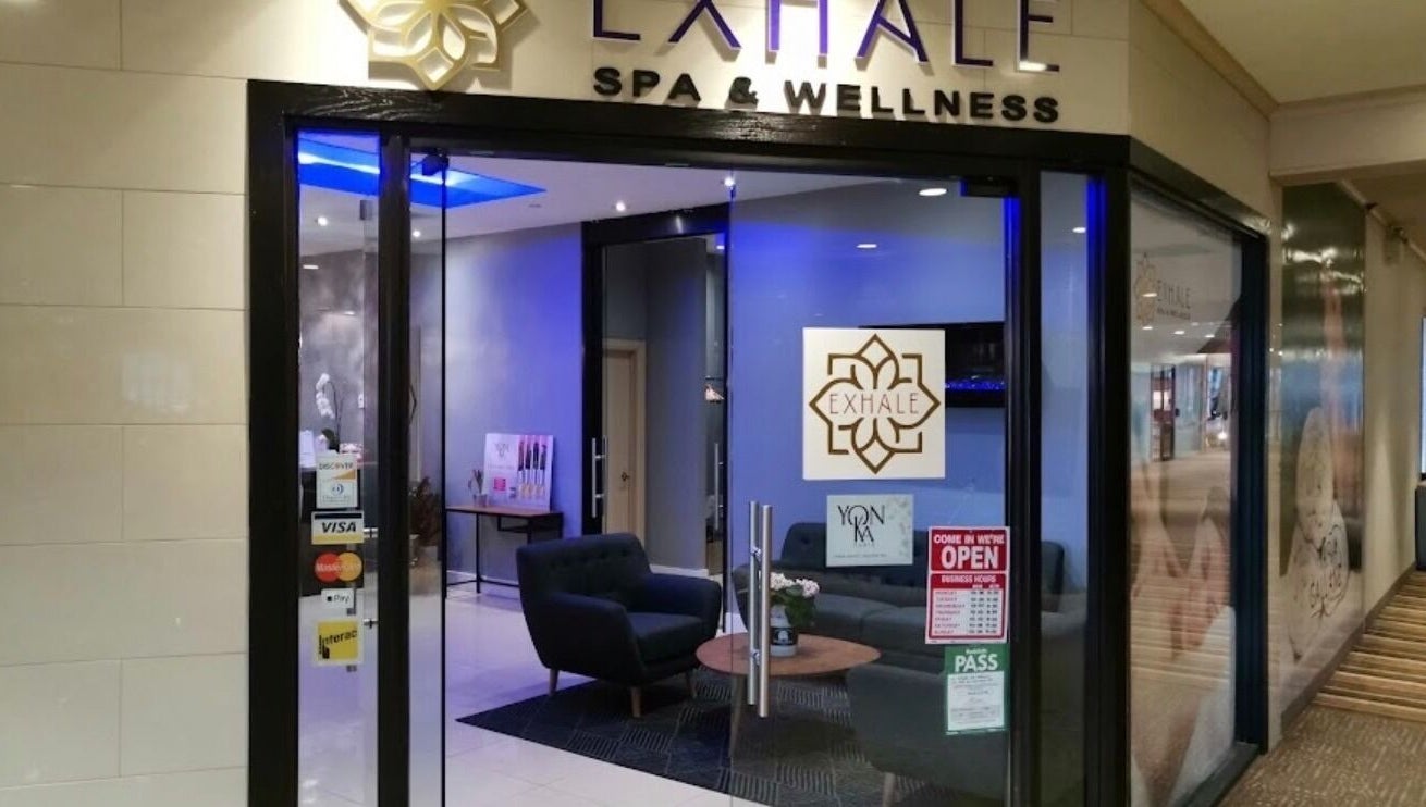 Entrance of Exhale Spa and WellnessElite in Toronto, Ontario, CA, showcasing a cozy interior and welcoming ambiance.