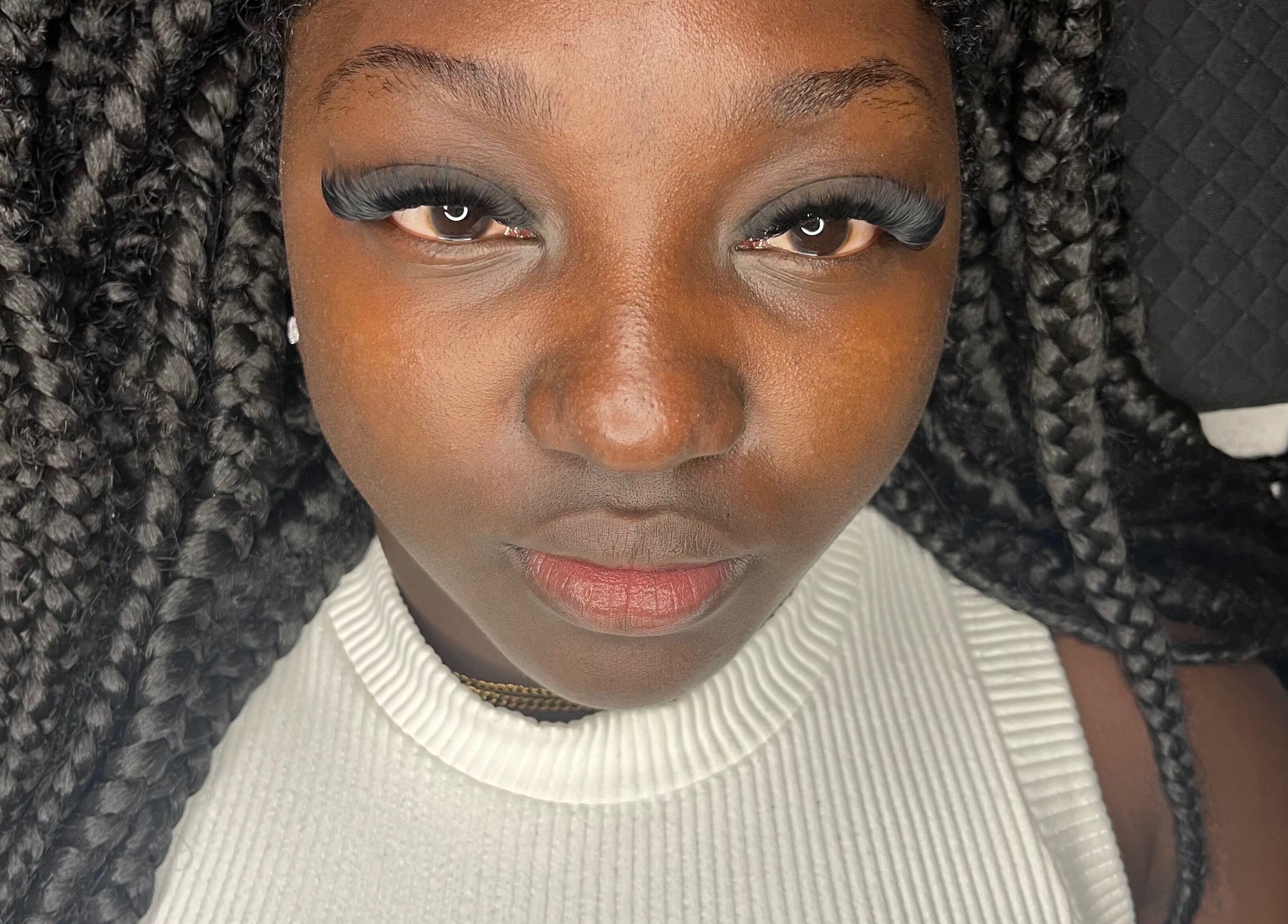 Close-up of a woman with styled eyelashes at nudíor, Bridgetown, Saint Michael, BB.