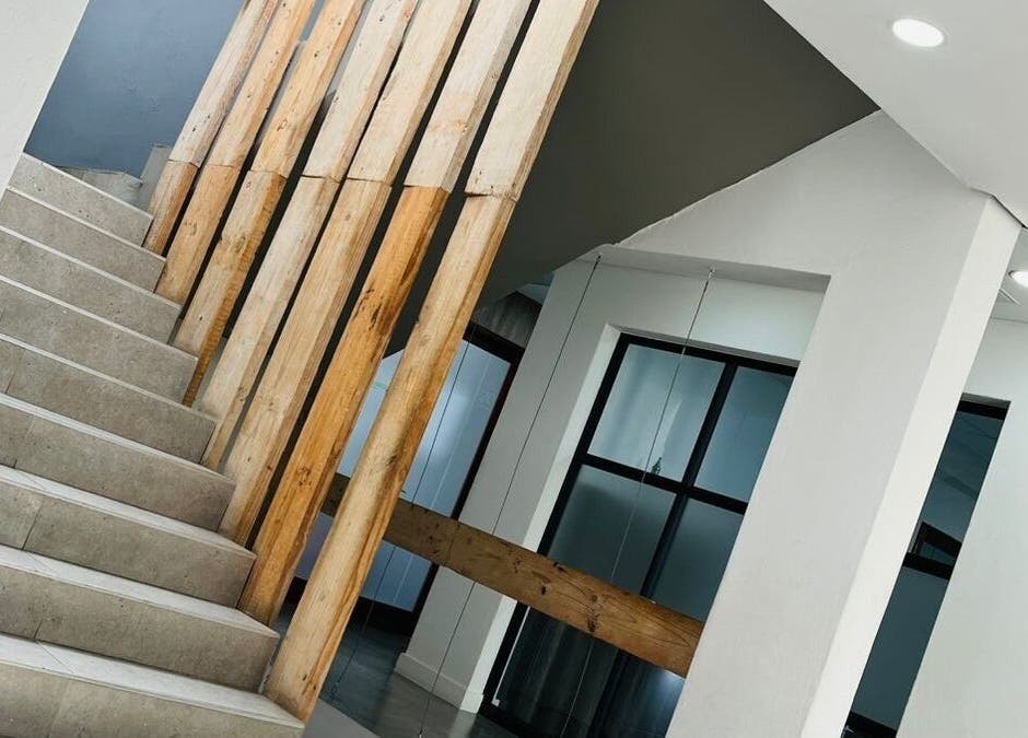 Stunning staircase with wood accents at Indalo Botique, Midrand, Gauteng, ZA. Perfect blend of style and architecture.