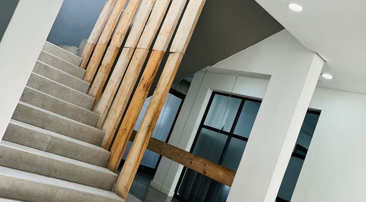 Stunning staircase with wood accents at Indalo Botique, Midrand, Gauteng, ZA. Perfect blend of style and architecture.