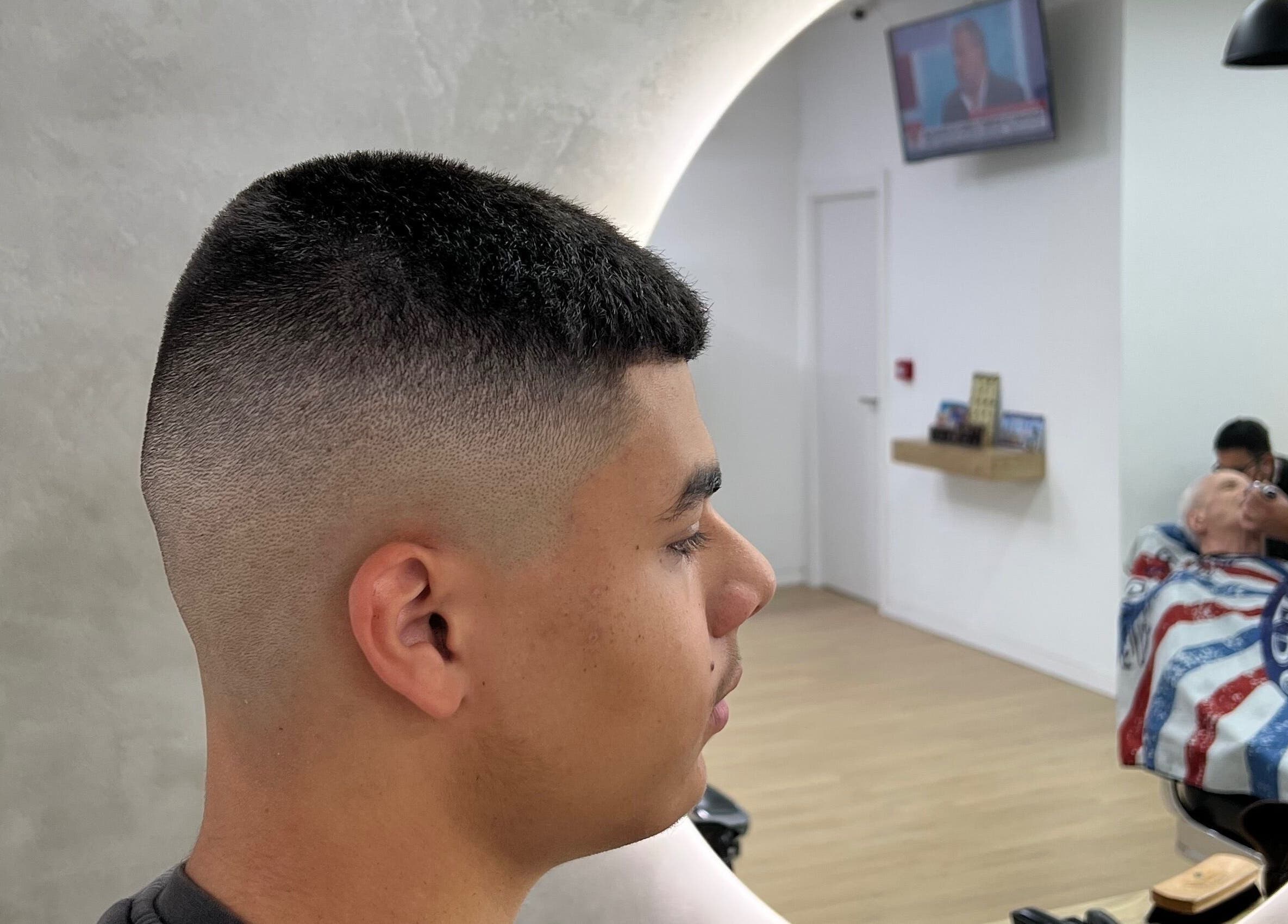 Modern fade haircut at Barbearia Lusitania in Santo António Dos Cavaleiros, Lisboa, PT.