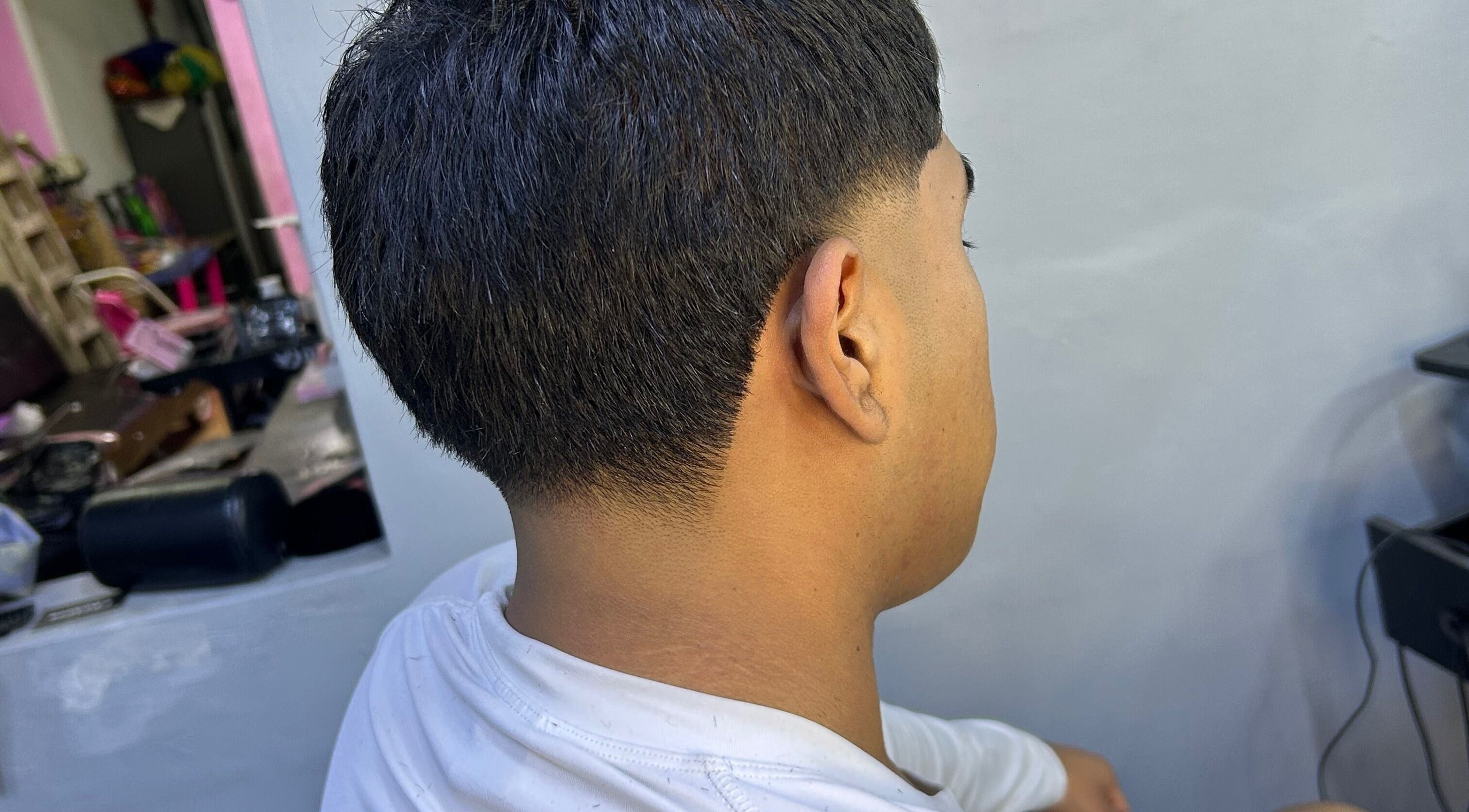 Corte de cabello moderno en Reset Barber, Callao, Callao, PE, mostrando un acabado preciso y elegante.