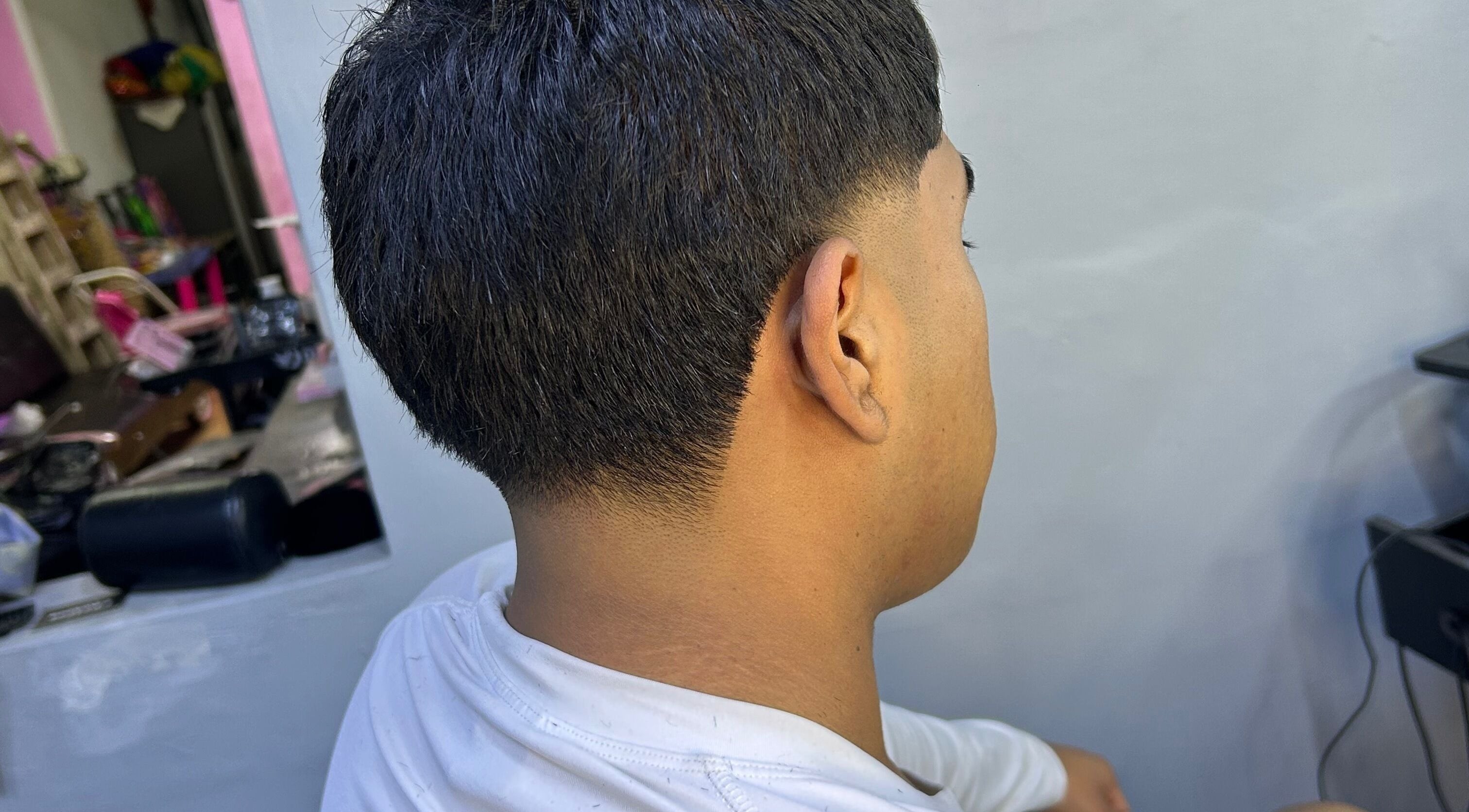 Corte de cabello moderno en Reset Barber, Callao, Callao, PE, mostrando un acabado preciso y elegante.