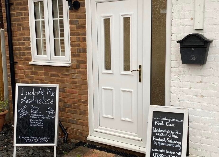 Entrance to Essex Foot Care, South Ockendon, England, GB, featuring a welcoming chalkboard sign.