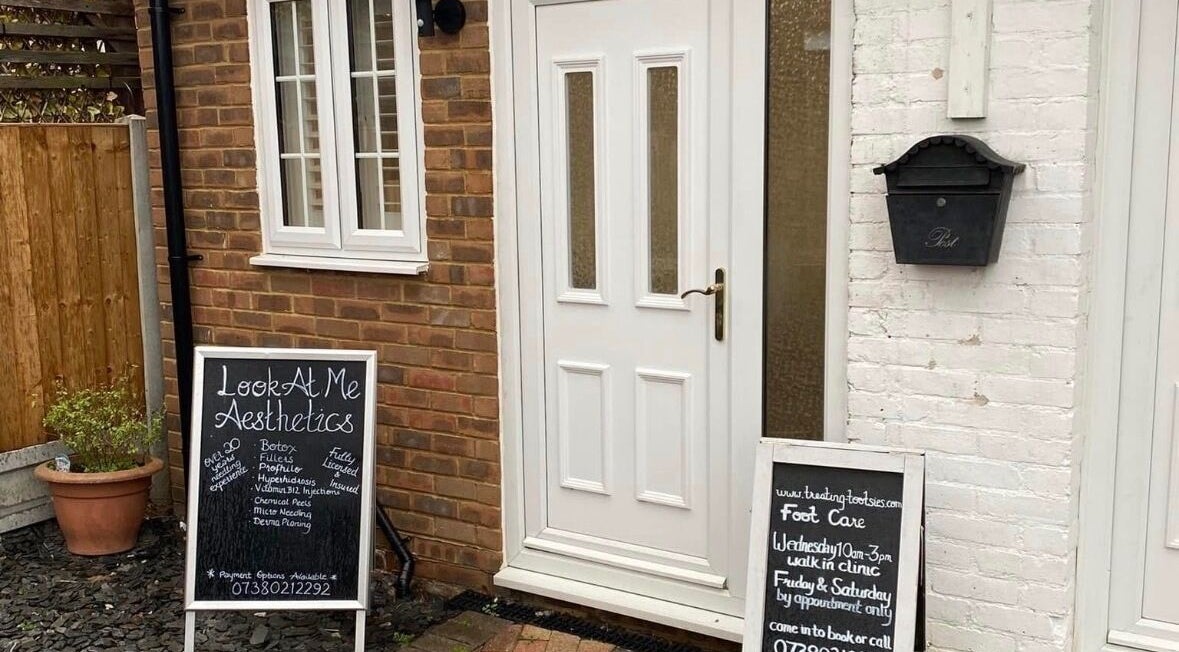 Entrance to Essex Foot Care, South Ockendon, England, GB, featuring a welcoming chalkboard sign.