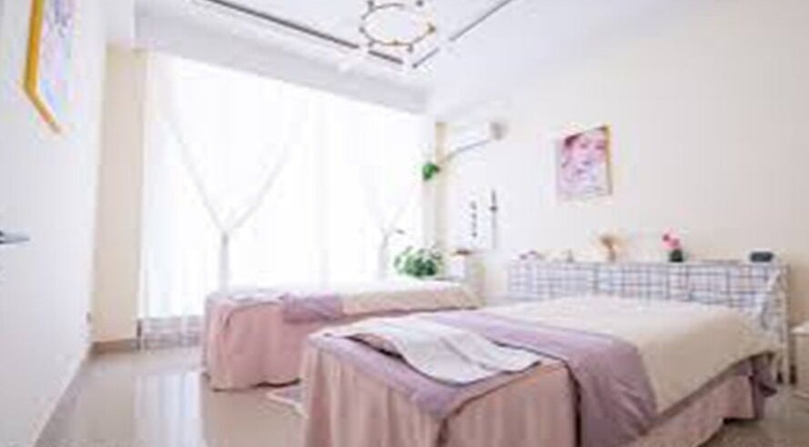 Elegant treatment room at Big Beauty Hair Care, Quincy, Massachusetts, US with soft lighting and cozy beds.