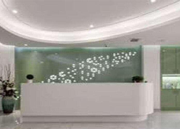 Reception area of Big Beauty Hair Care in Quincy, Massachusetts, US with modern decor and soft lighting.