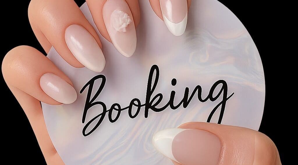 Elegant white manicured nails holding Beauty Hause booking card in Alberton, Gauteng, ZA.