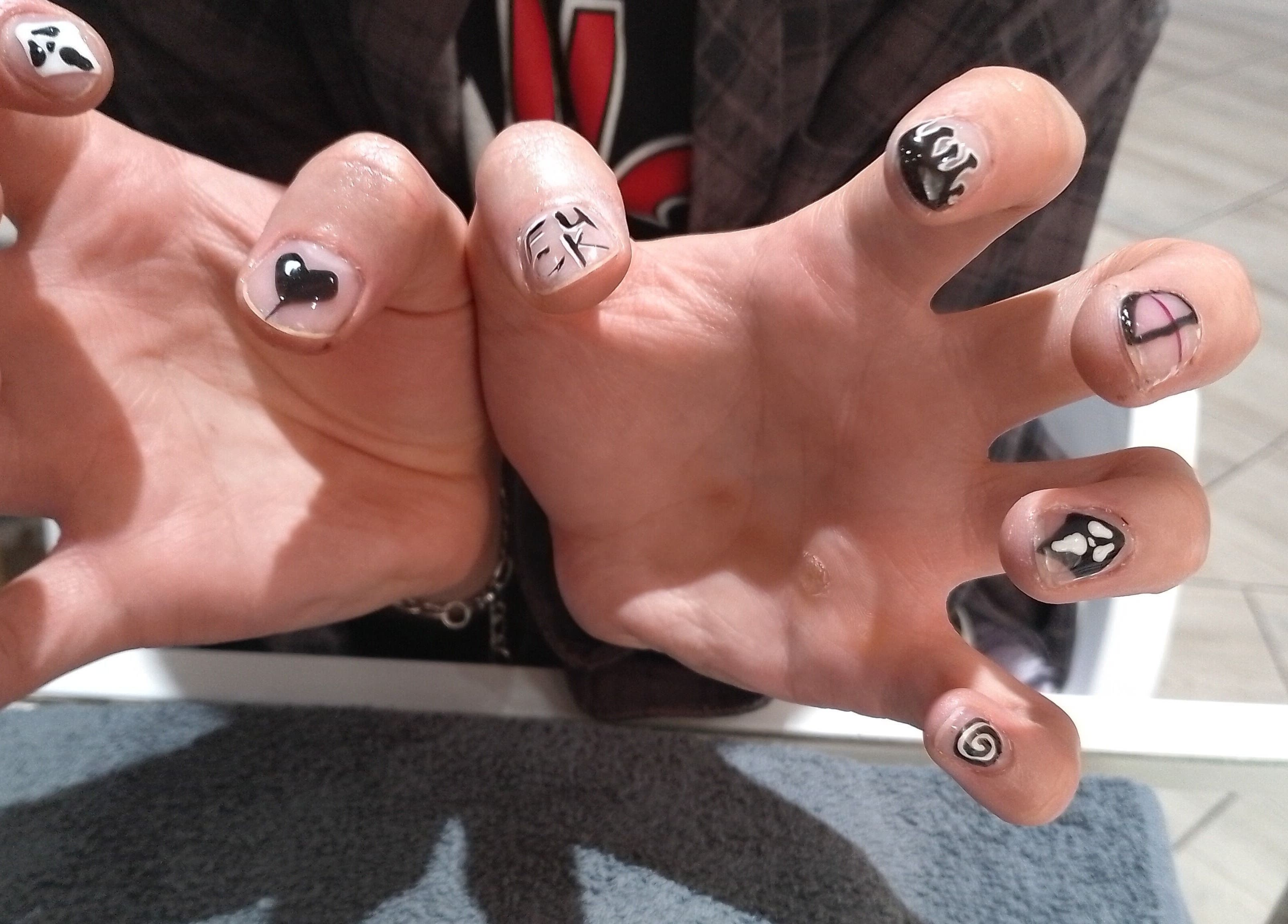 Unique nail art at Beauty Hause in Alberton, Gauteng, ZA showcasing creative hand-painted designs.