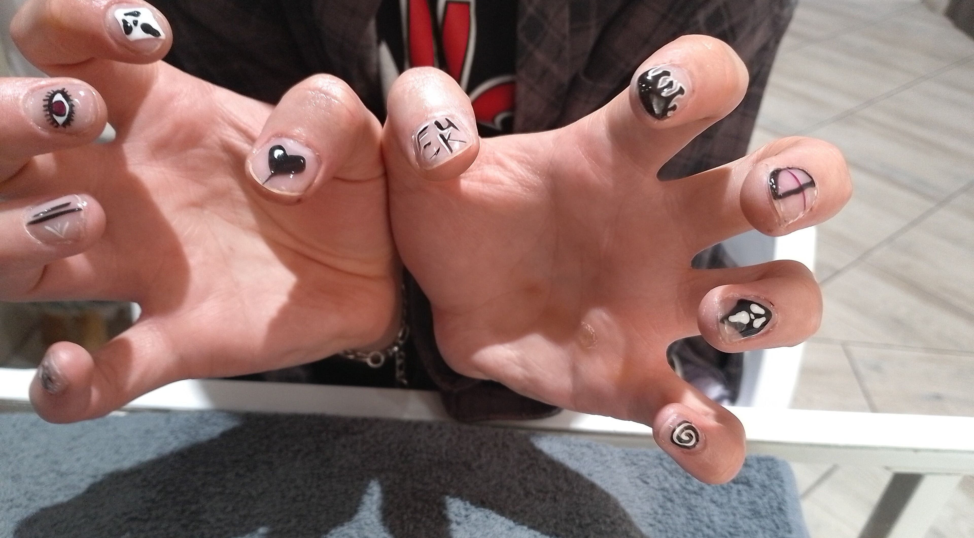 Unique nail art at Beauty Hause in Alberton, Gauteng, ZA showcasing creative hand-painted designs.