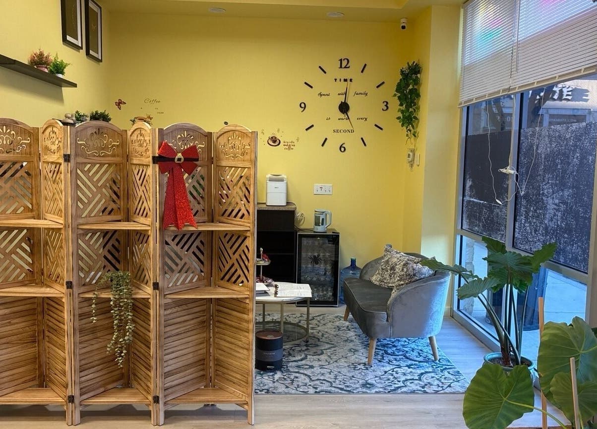 Cozy waiting area in Healing Hands Massage & Facial SPA, Round Rock, Texas, US with decorative partition.