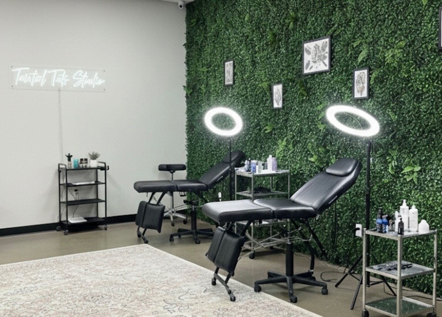 TaintedTats tattoo studio in Charlotte, North Carolina, US, featuring relaxing green decor and professional equipment.