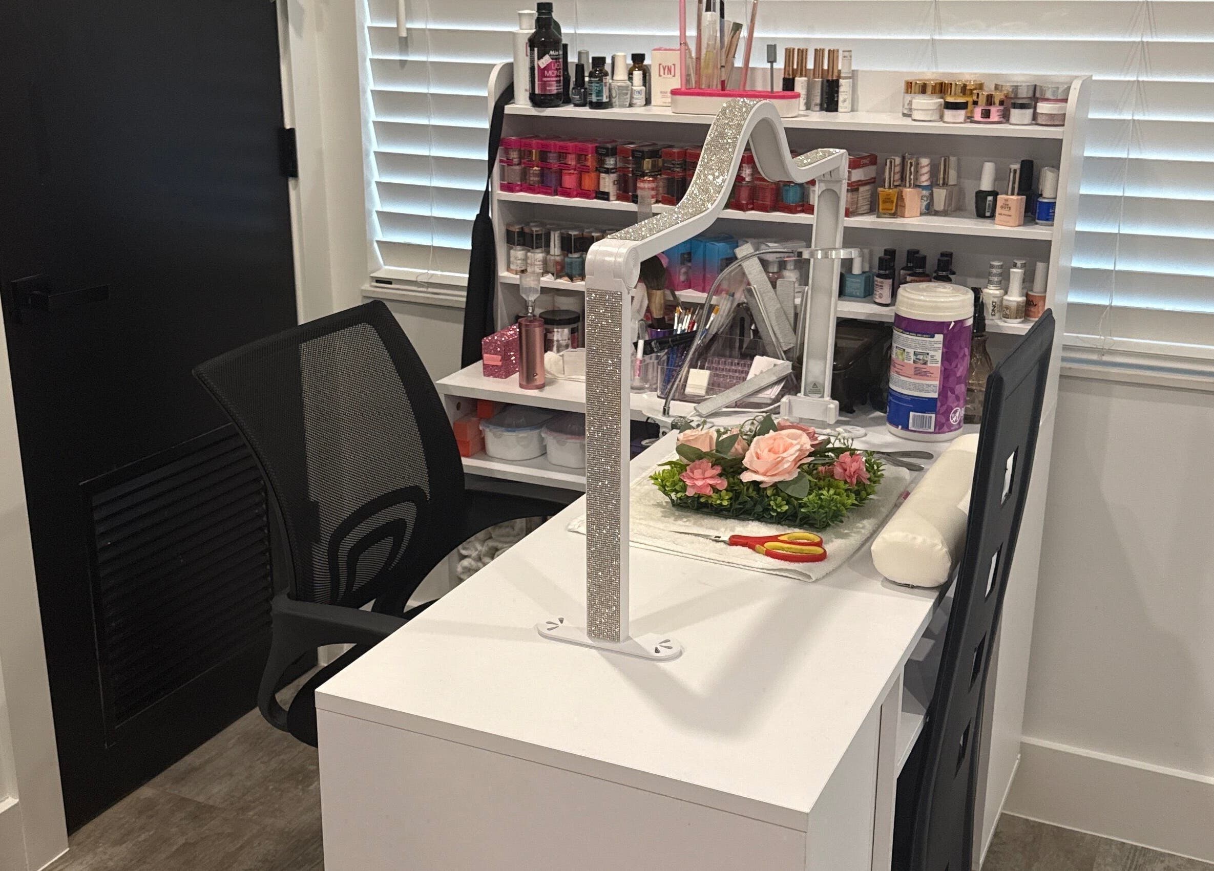 Yanet Nail Studio manicure station with products in West Palm Beach, Florida, US.