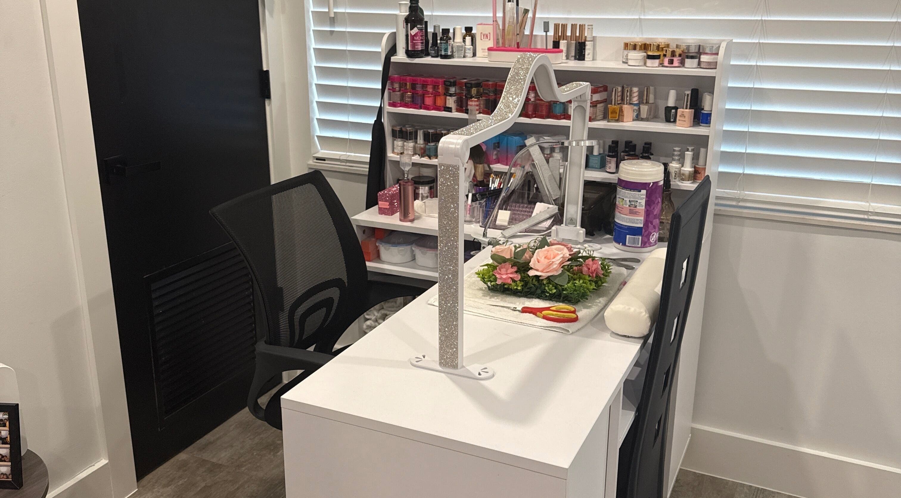 Yanet Nail Studio manicure station with products in West Palm Beach, Florida, US.