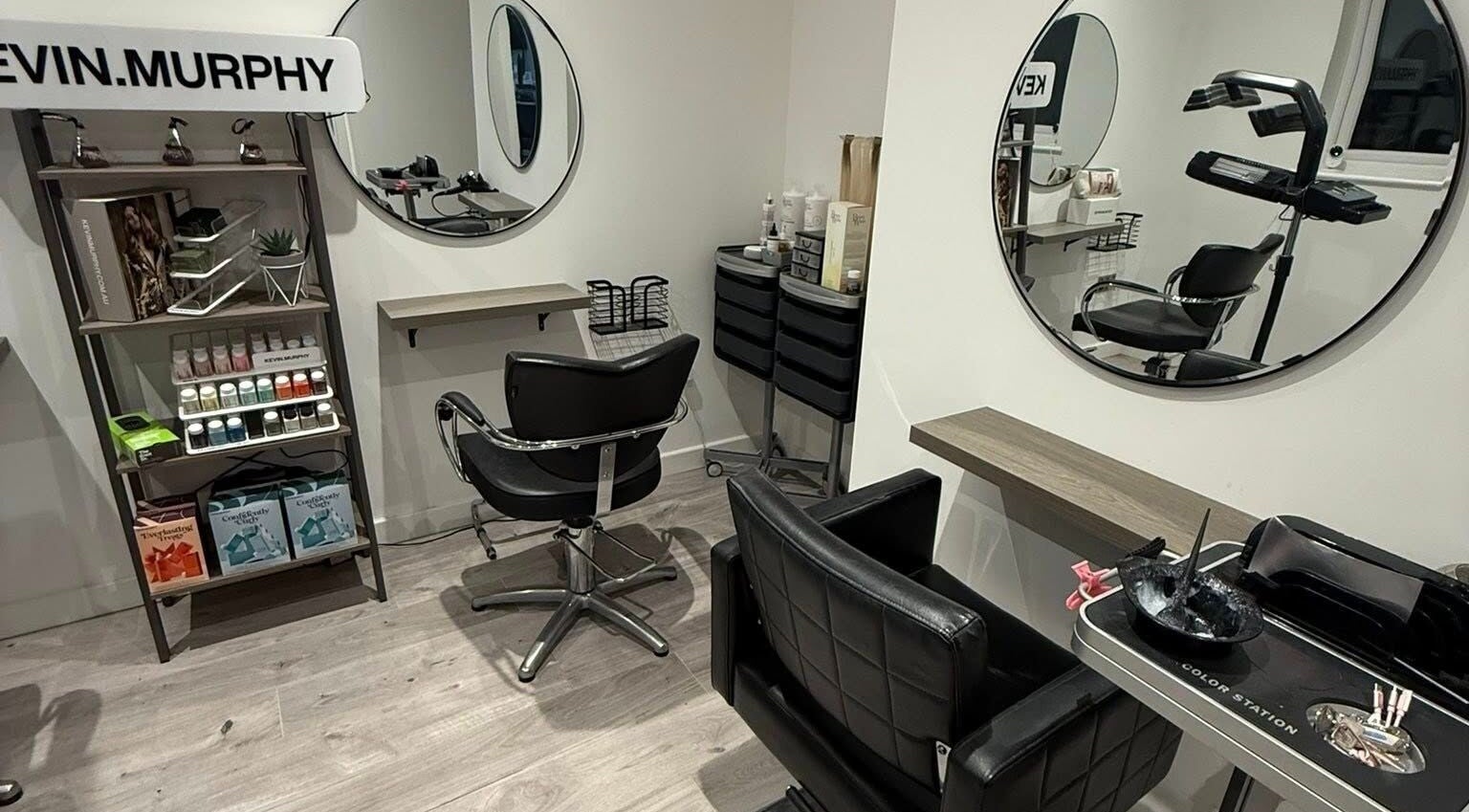 Modern salon interior at Hair By Jen, Jersey, St Saviour, JE, featuring sleek chairs and beauty products.