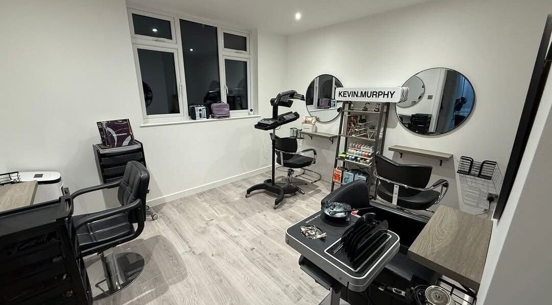 Modern salon interior at Hair By Jen, Jersey, St Saviour, JE, featuring stylish chairs and beauty equipment.