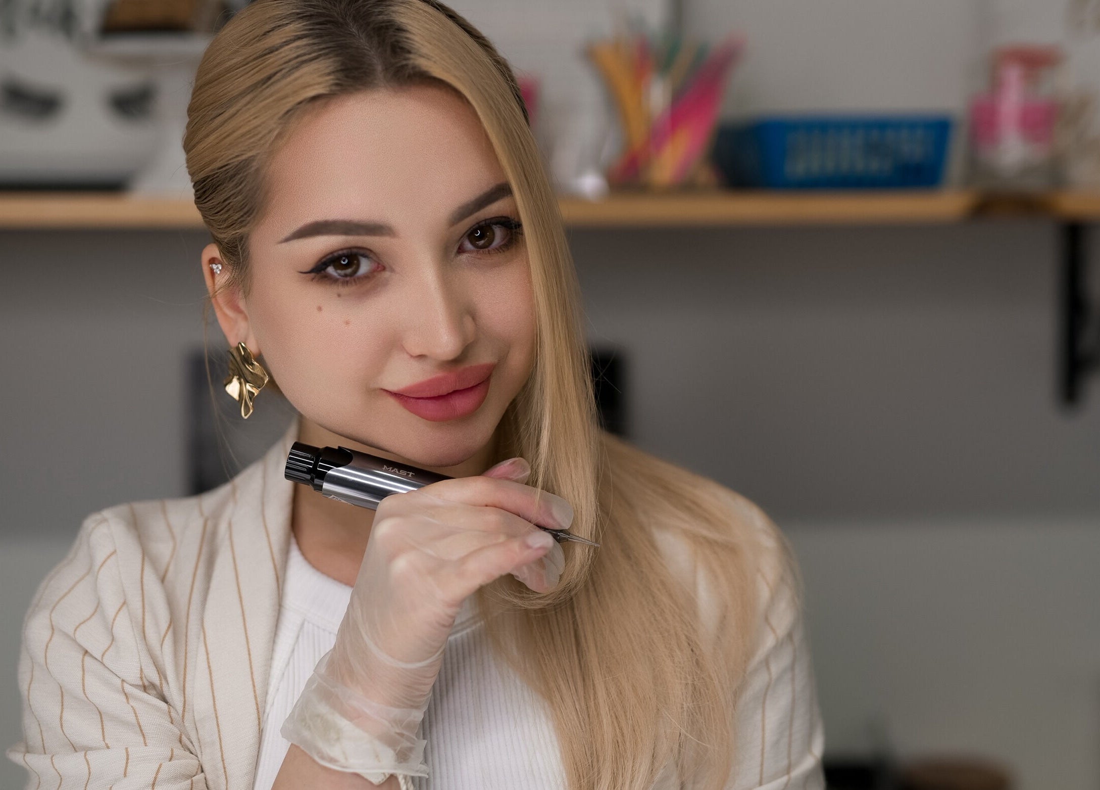 Expert nail artist at Alisha Ink Nails, Palm Harbor, Florida, US, showcasing precision tools.