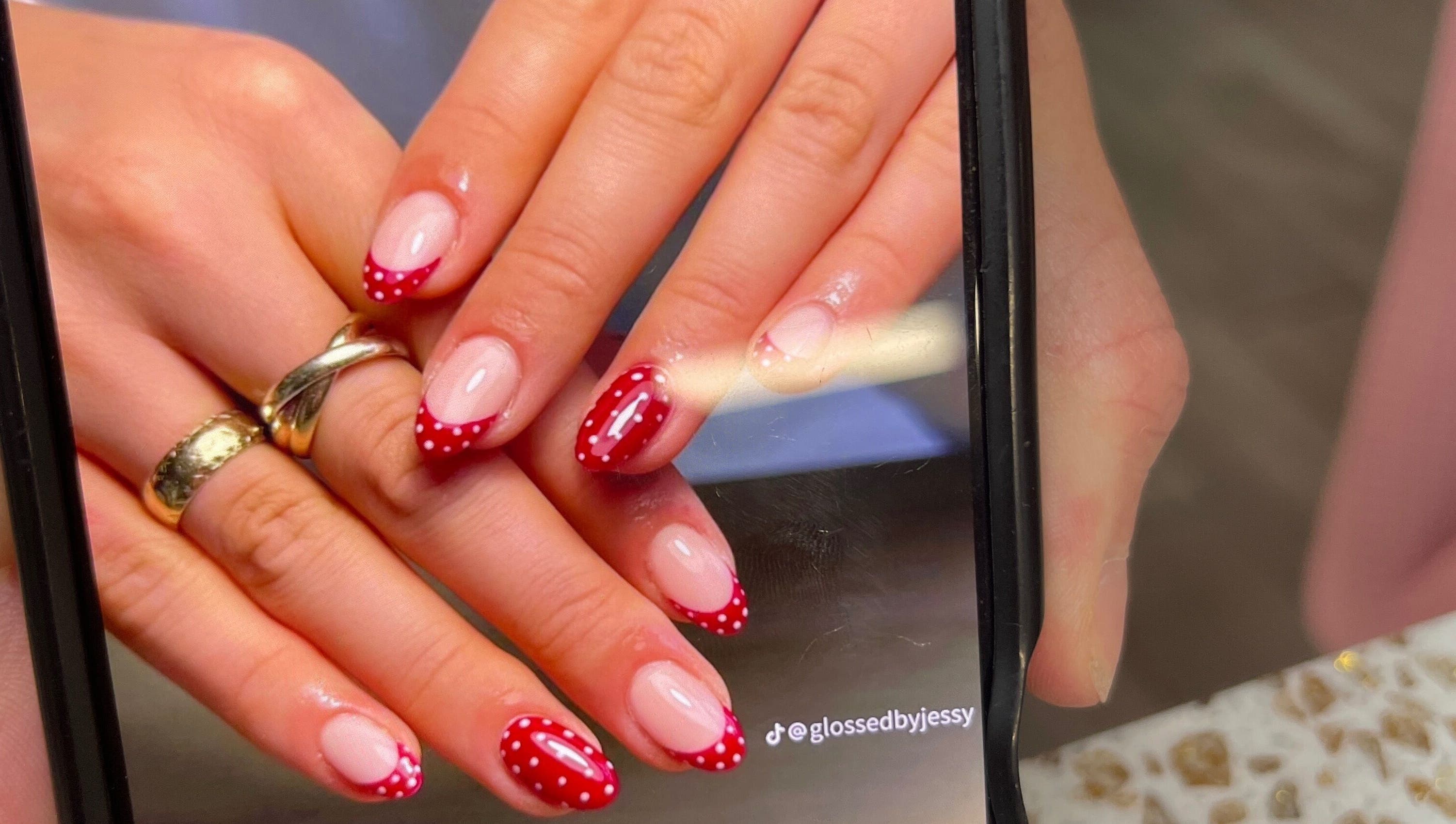 Red polka dot nail design at Linda Gervais Nail & Spa, Columbia, South Carolina, US.
