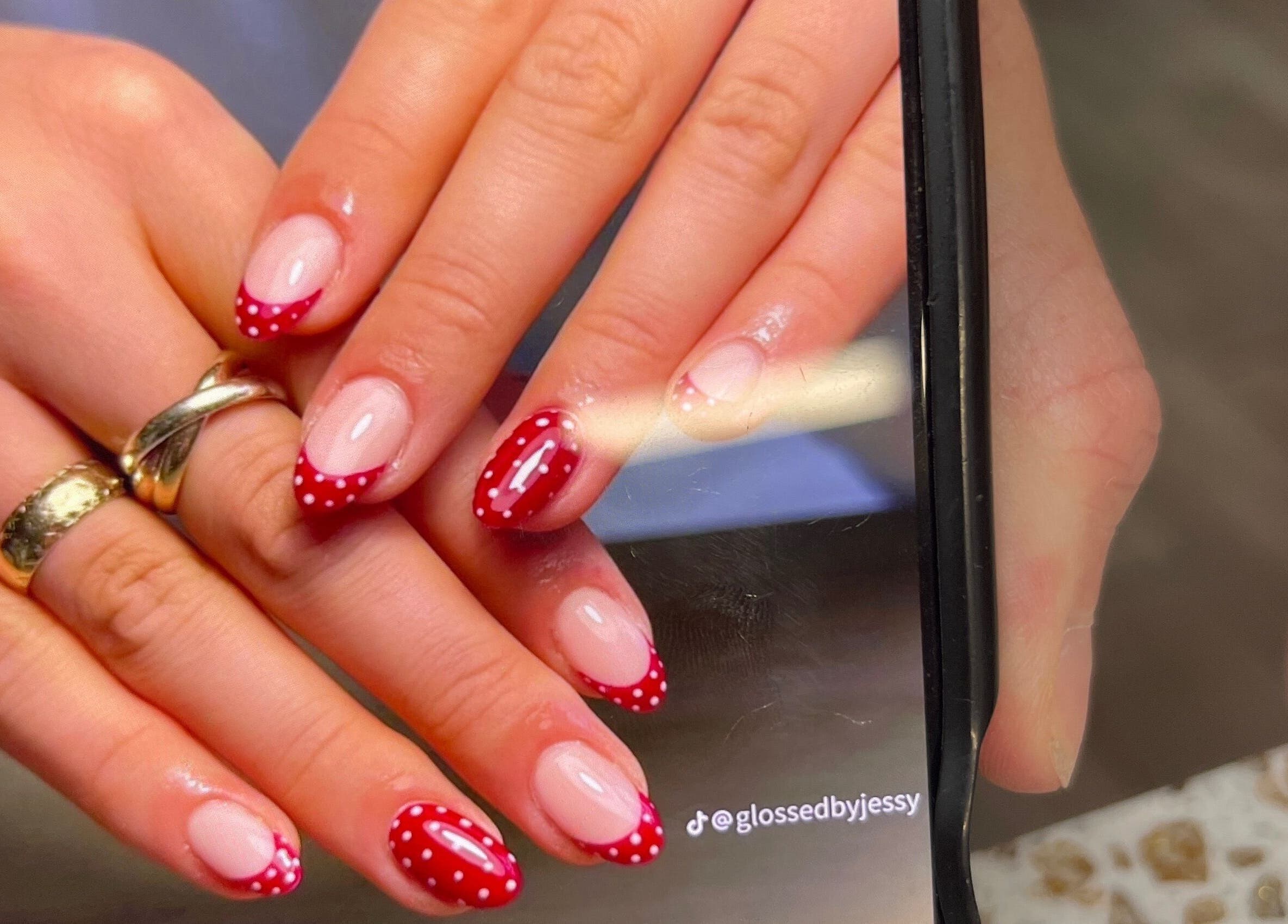 Red polka dot nail design at Linda Gervais Nail & Spa, Columbia, South Carolina, US.