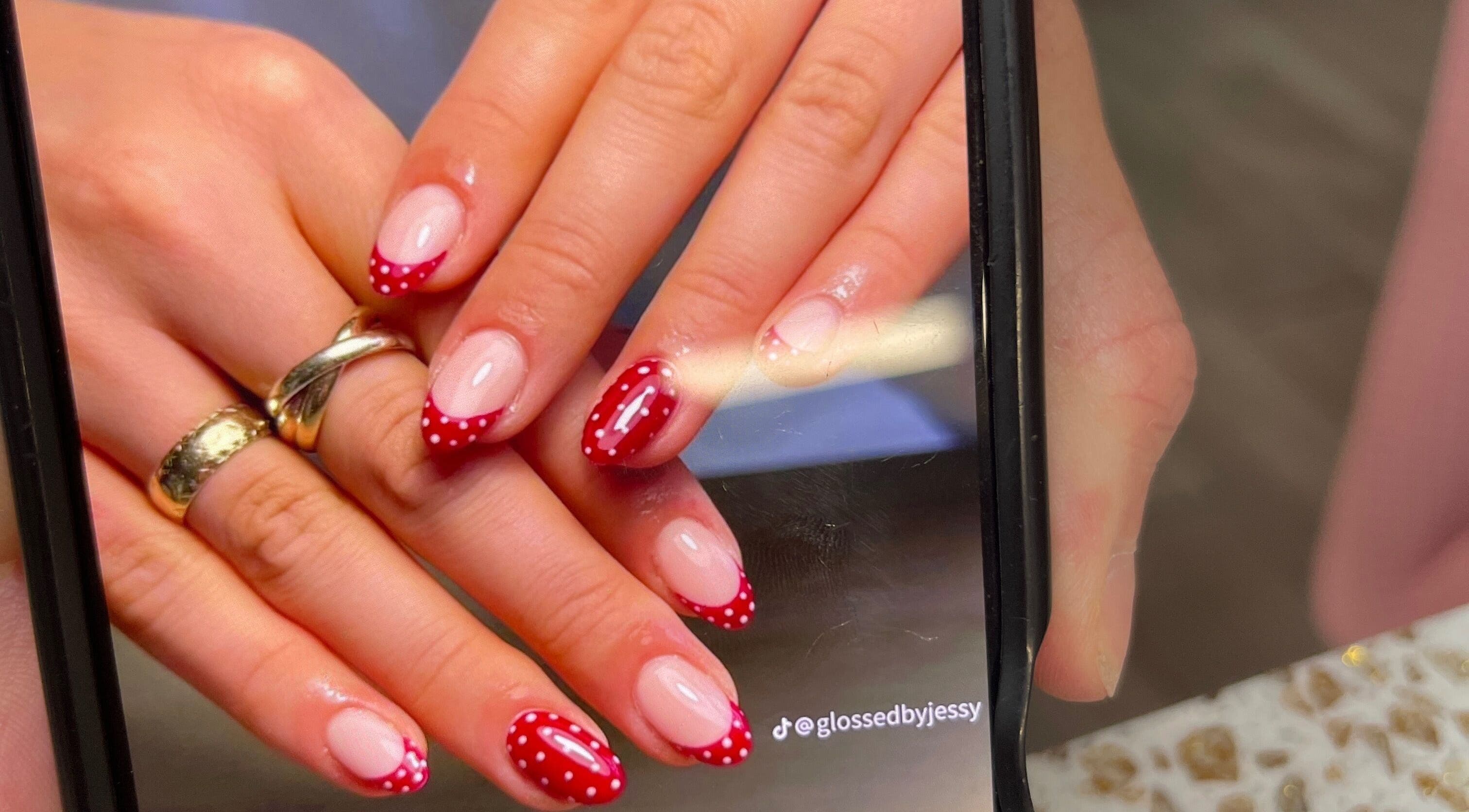 Red polka dot nail design at Linda Gervais Nail & Spa, Columbia, South Carolina, US.