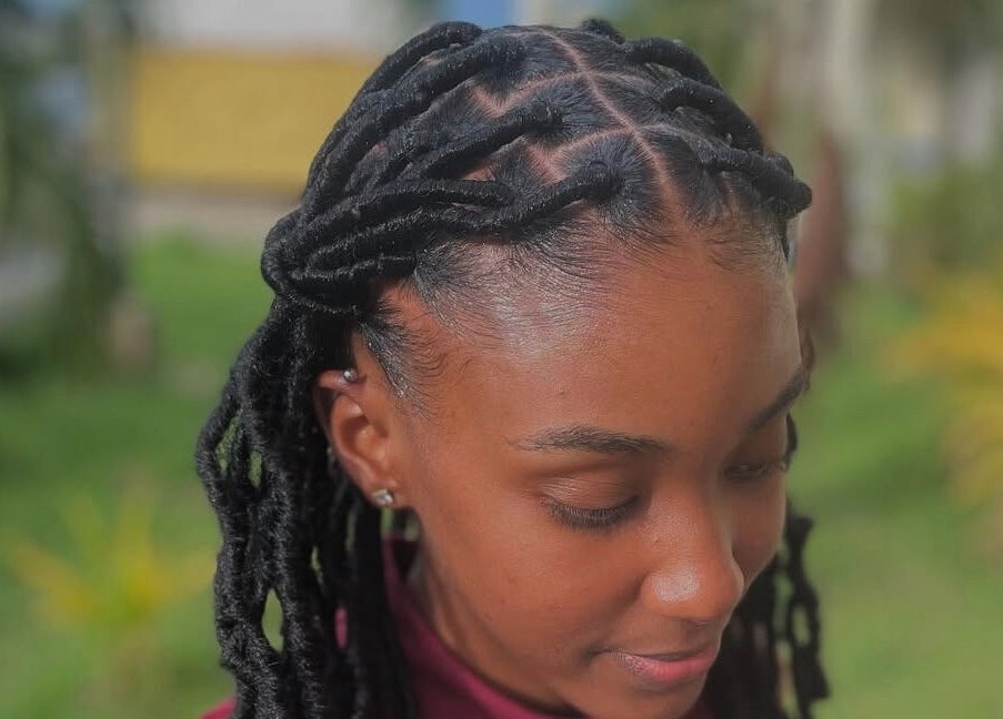 Stylish braided hairstyle at Glambynicia in Chaguanas, Chaguanas, TT, showcasing intricate design.