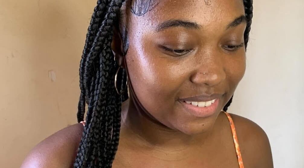 Beautiful braided hairstyle at Glambynicia, Chaguanas, Chaguanas, TT, highlighting natural beauty.