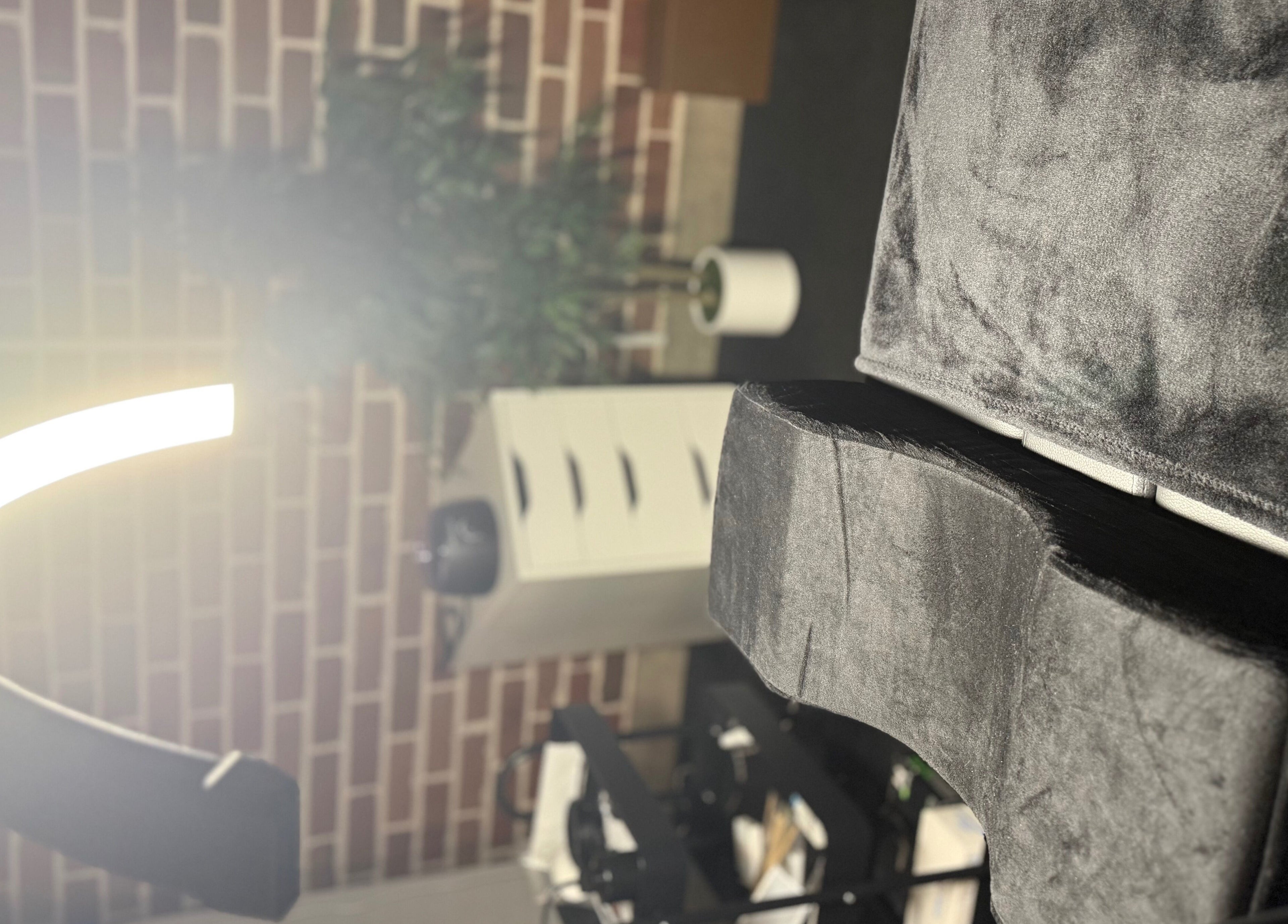 Cozy LuxeBrows seating area in Grasmere, New South Wales, AU with modern lighting and plush decor.