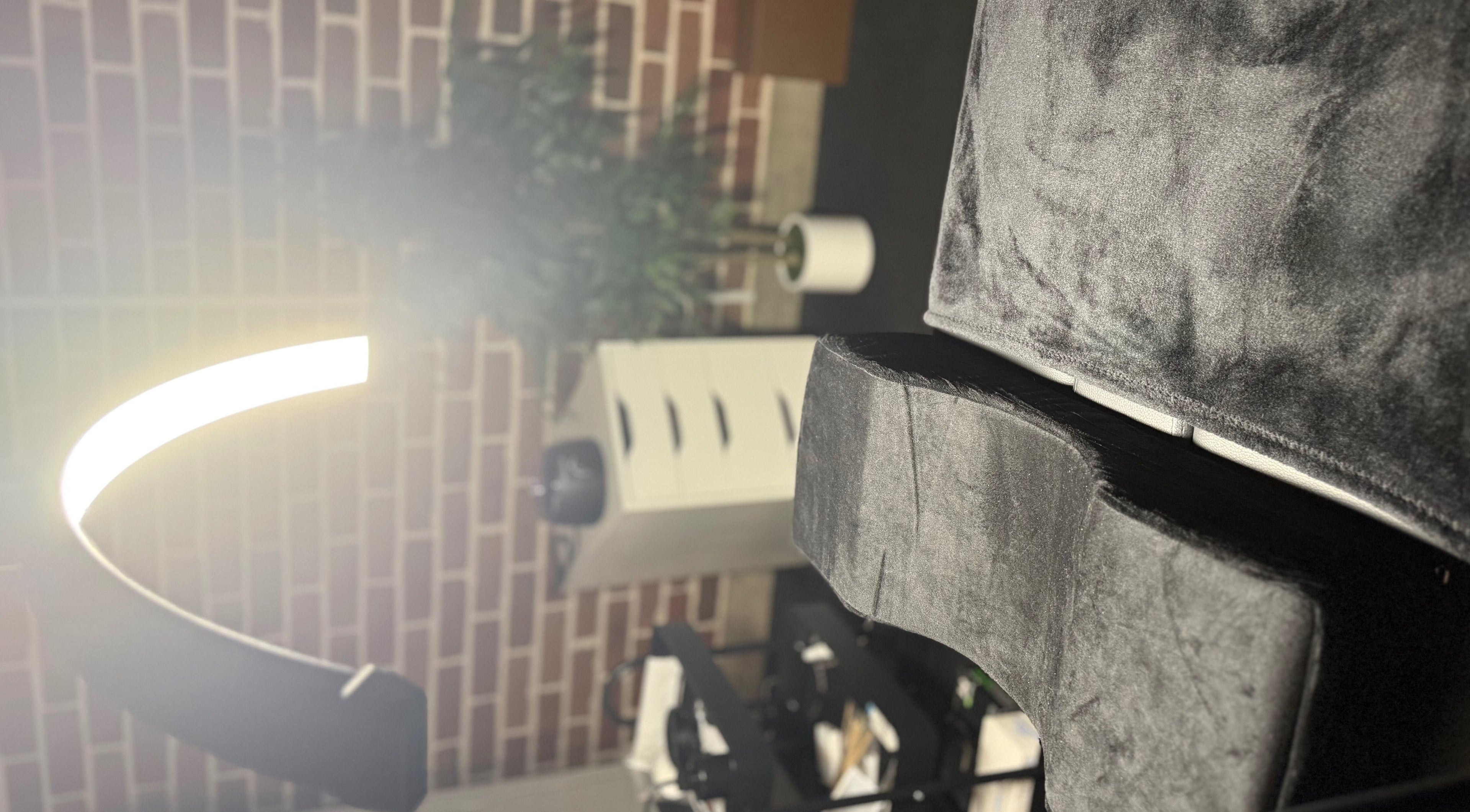 Cozy LuxeBrows seating area in Grasmere, New South Wales, AU with modern lighting and plush decor.