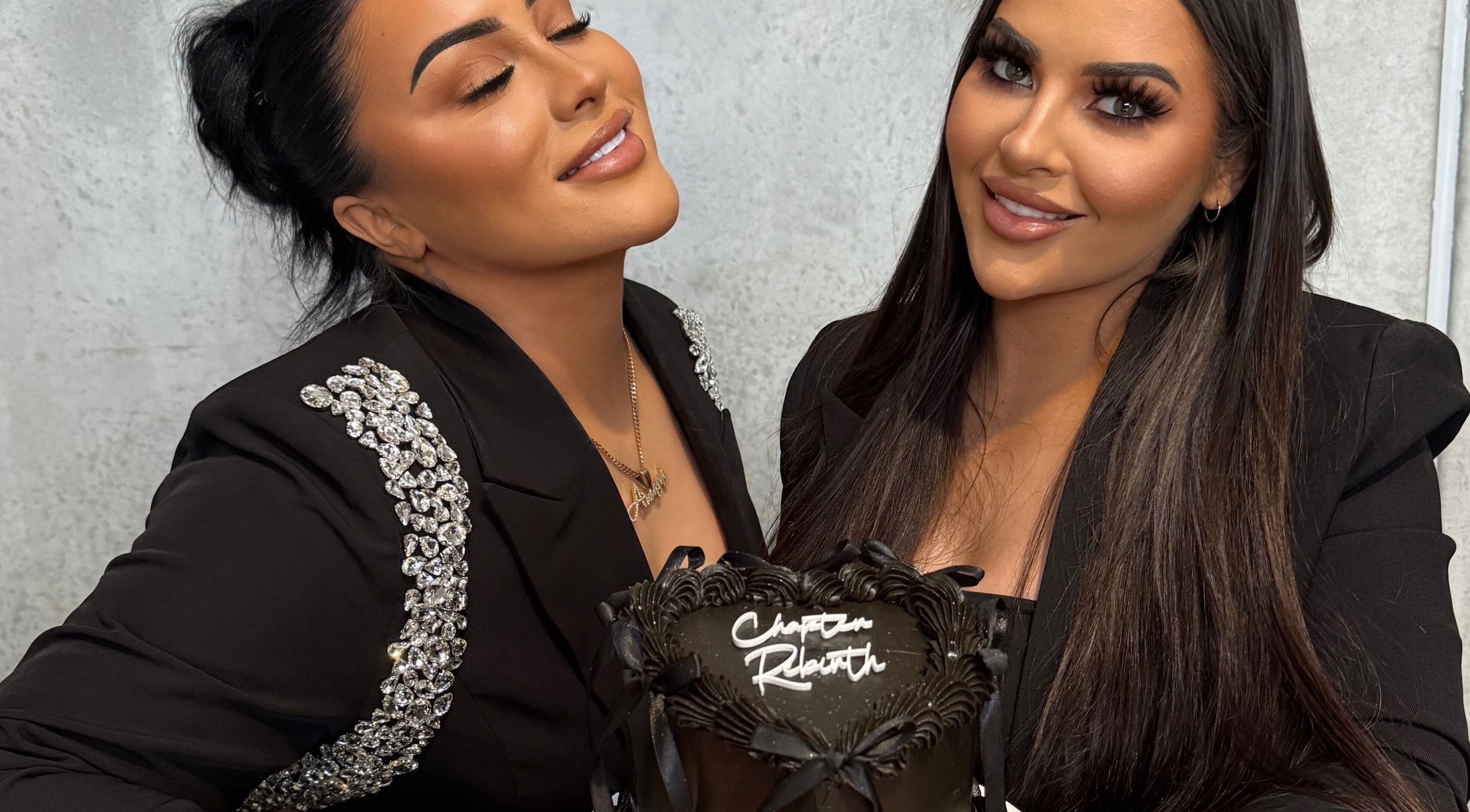 Two women at Brow Bottega, Wellington, NZ, holding a decorative cake in a stylish setting.
