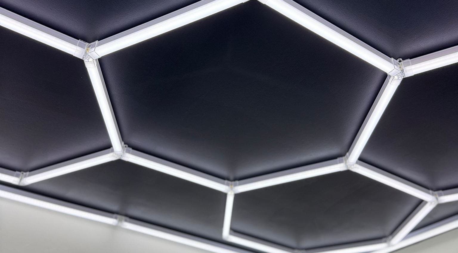 Modern hexagon ceiling lights at Barber N’ The Hood, Kralendijk, Bonaire, BQ.