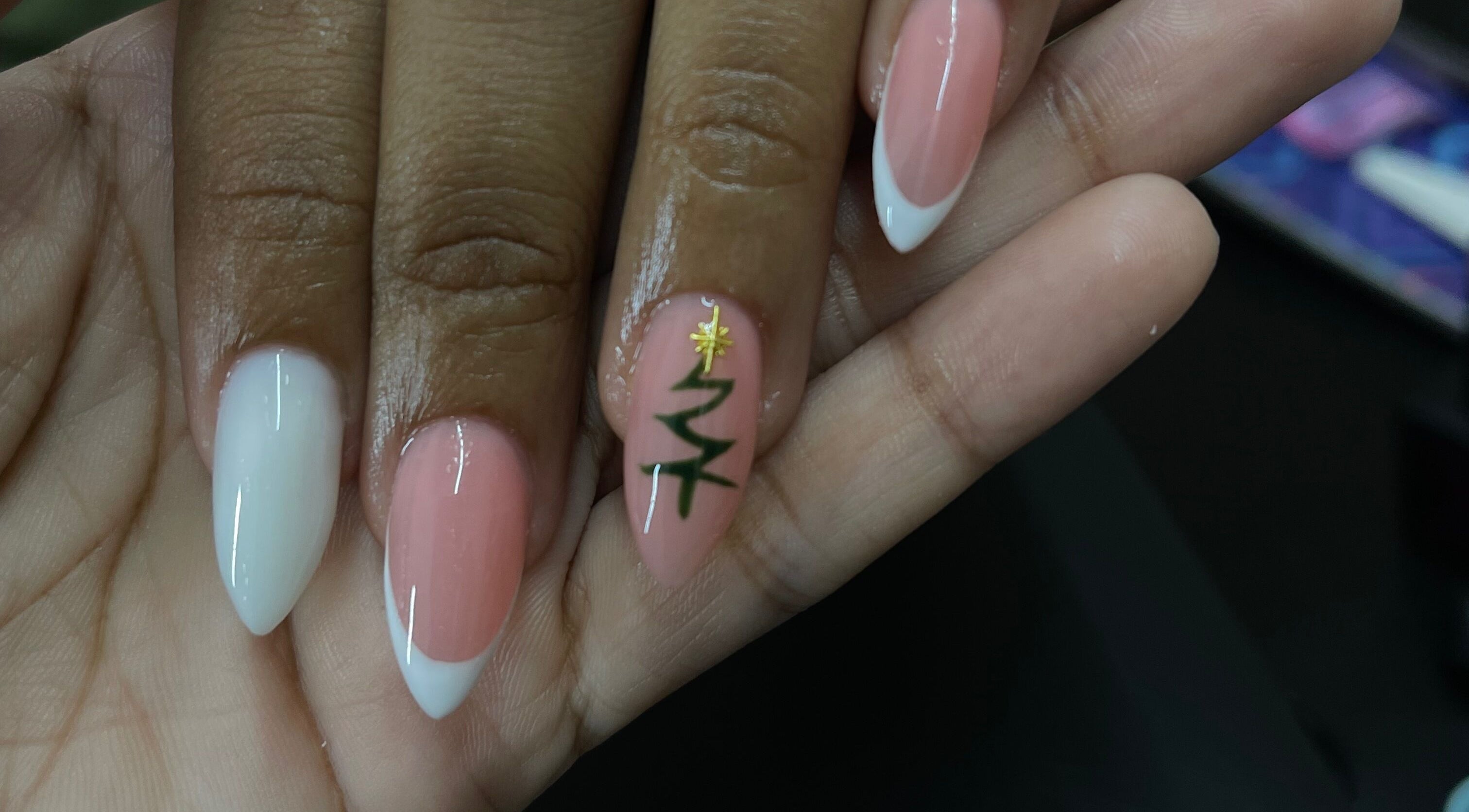 Stylish nail art at Nail Therapy by Lilly, Arima, Arima Borough Corporation, TT. French tips with gold detail.