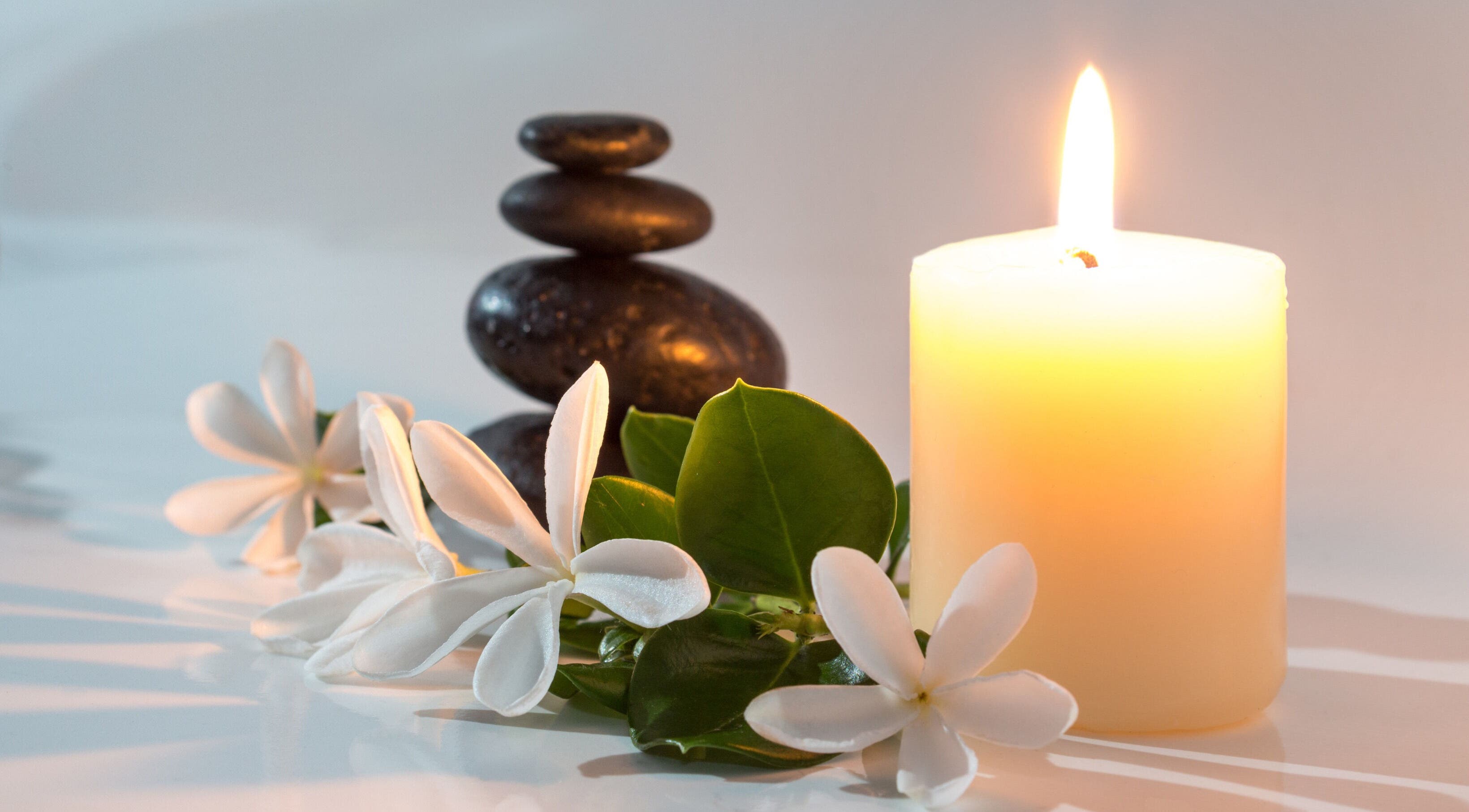 Zen Body Wellness in Centreville, Virginia, US offers tranquility with candles, stones, and flowers.