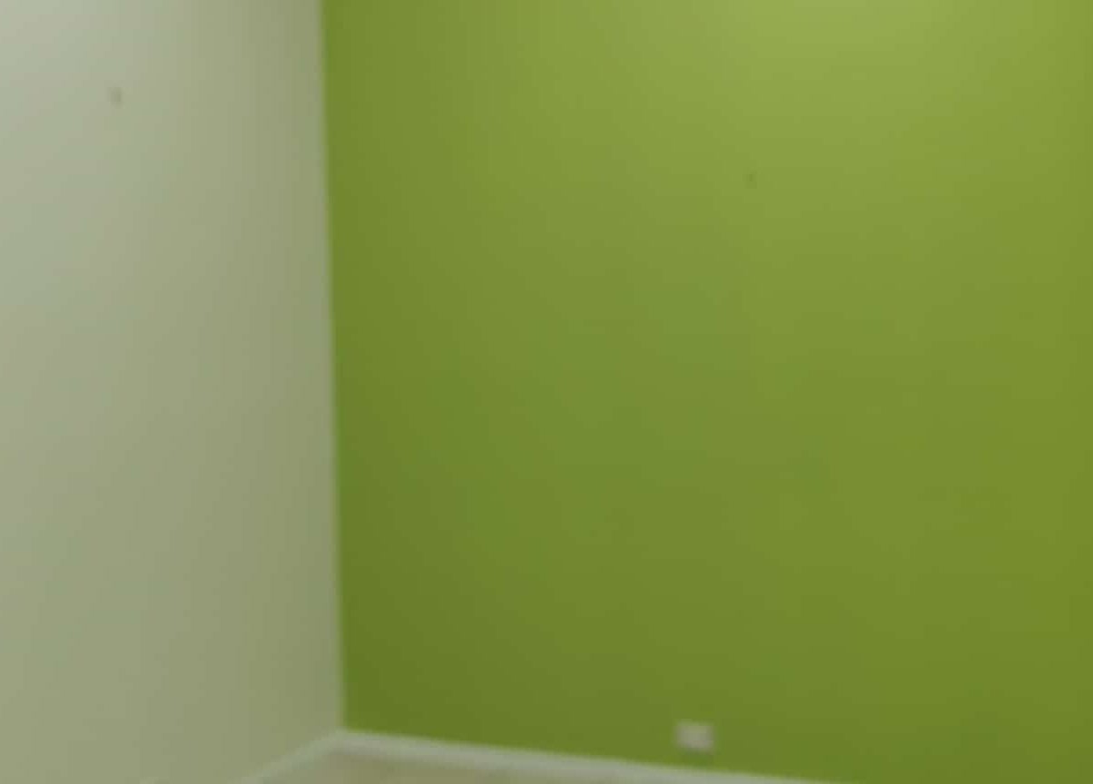 Simple green wall at Vanima, Ipswich, Queensland, AU, showcasing minimalist interior decor for relaxation.