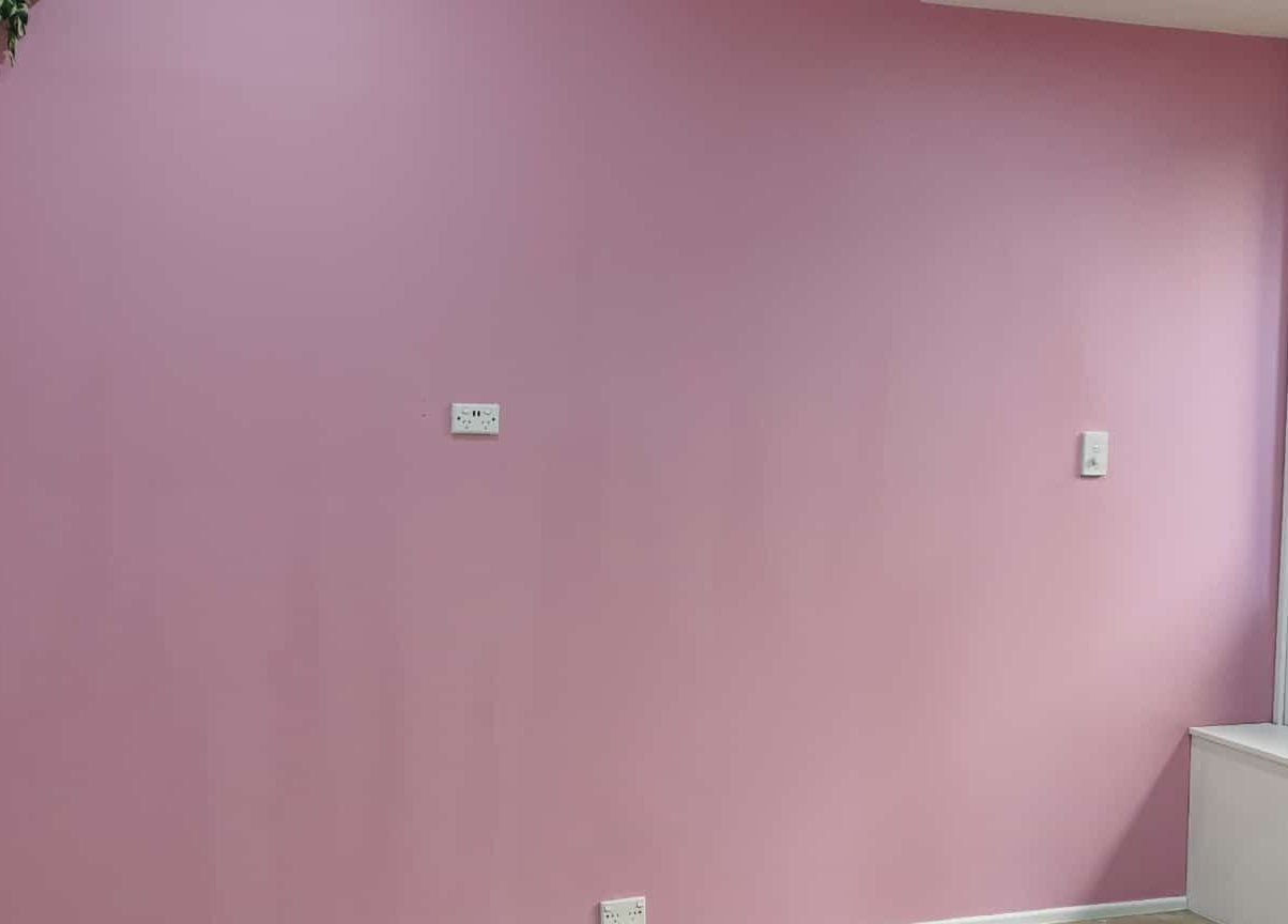 Elegant pink wall at Vanima, Ipswich, Queensland, AU. A serene backdrop for beauty treatments.