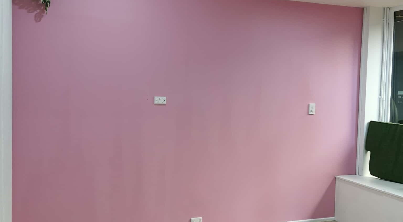 Elegant pink wall at Vanima, Ipswich, Queensland, AU. A serene backdrop for beauty treatments.