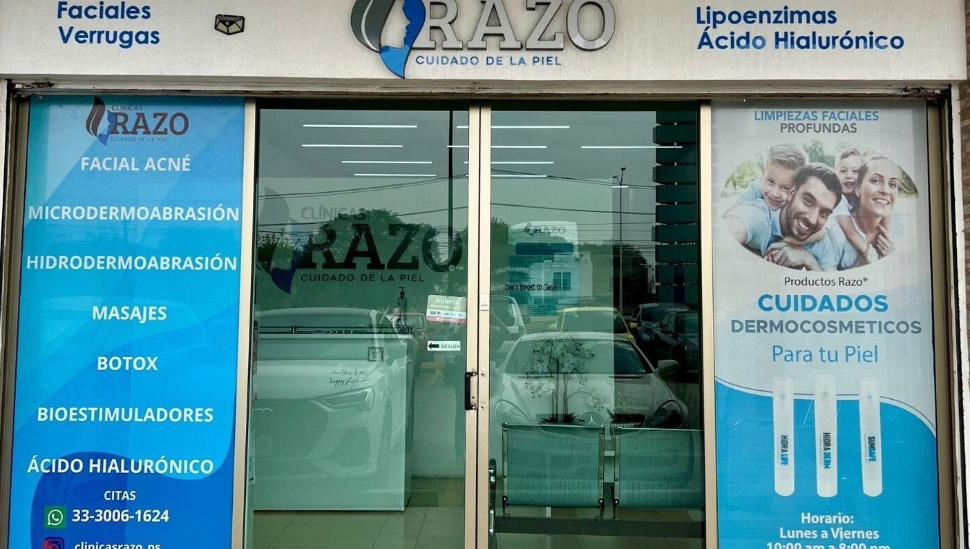 Entrance of Clínica Razo Plaza Sorrento in San Agustín, Jalisco, MX, displaying skincare service advertisements.