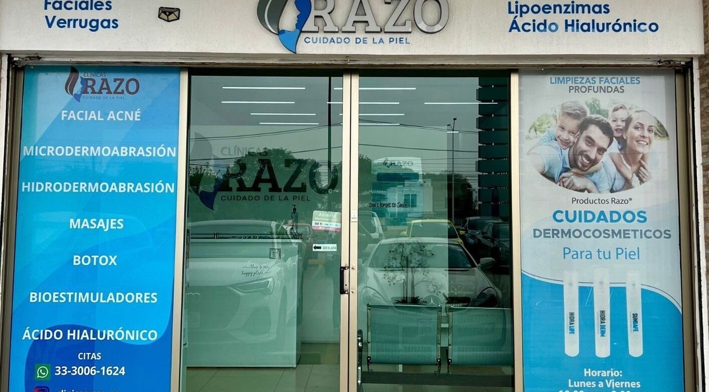 Entrance of Clínica Razo Plaza Sorrento in San Agustín, Jalisco, MX, displaying skincare service advertisements.