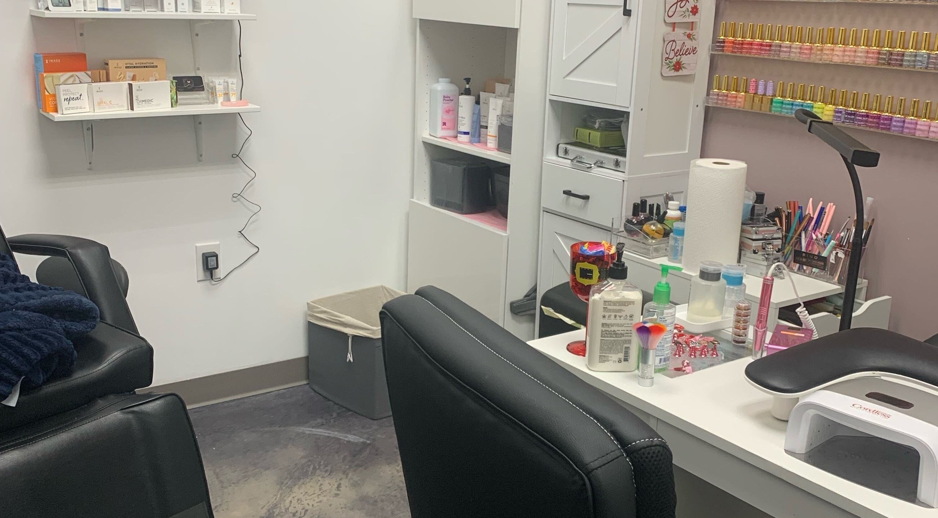 Gloss N Bare Studio's nail station with products in Midvale, Utah, US, showcasing sleek organization.