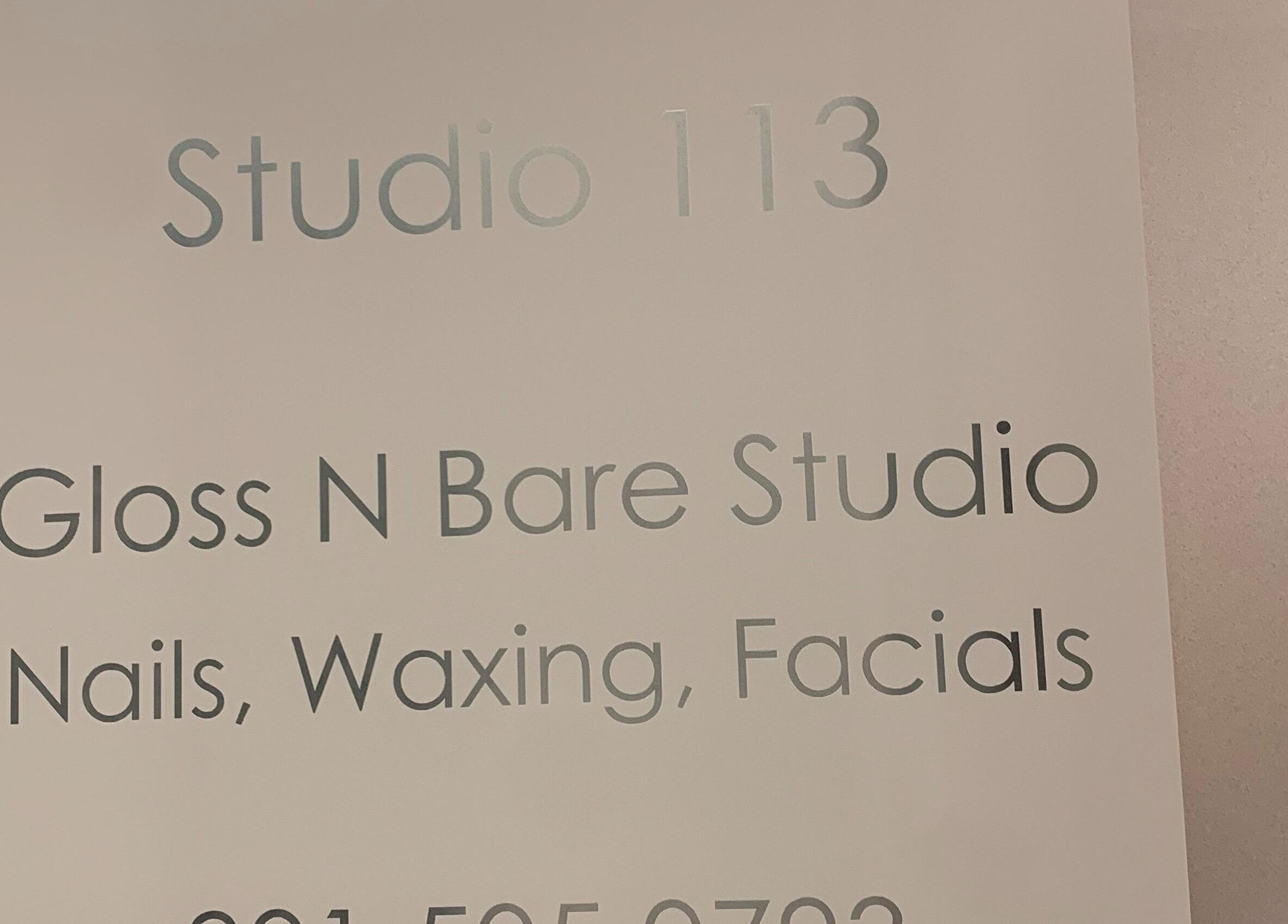 Signage for Gloss N Bare Studio in Midvale, Utah, US, offering nails, waxing, and facials.