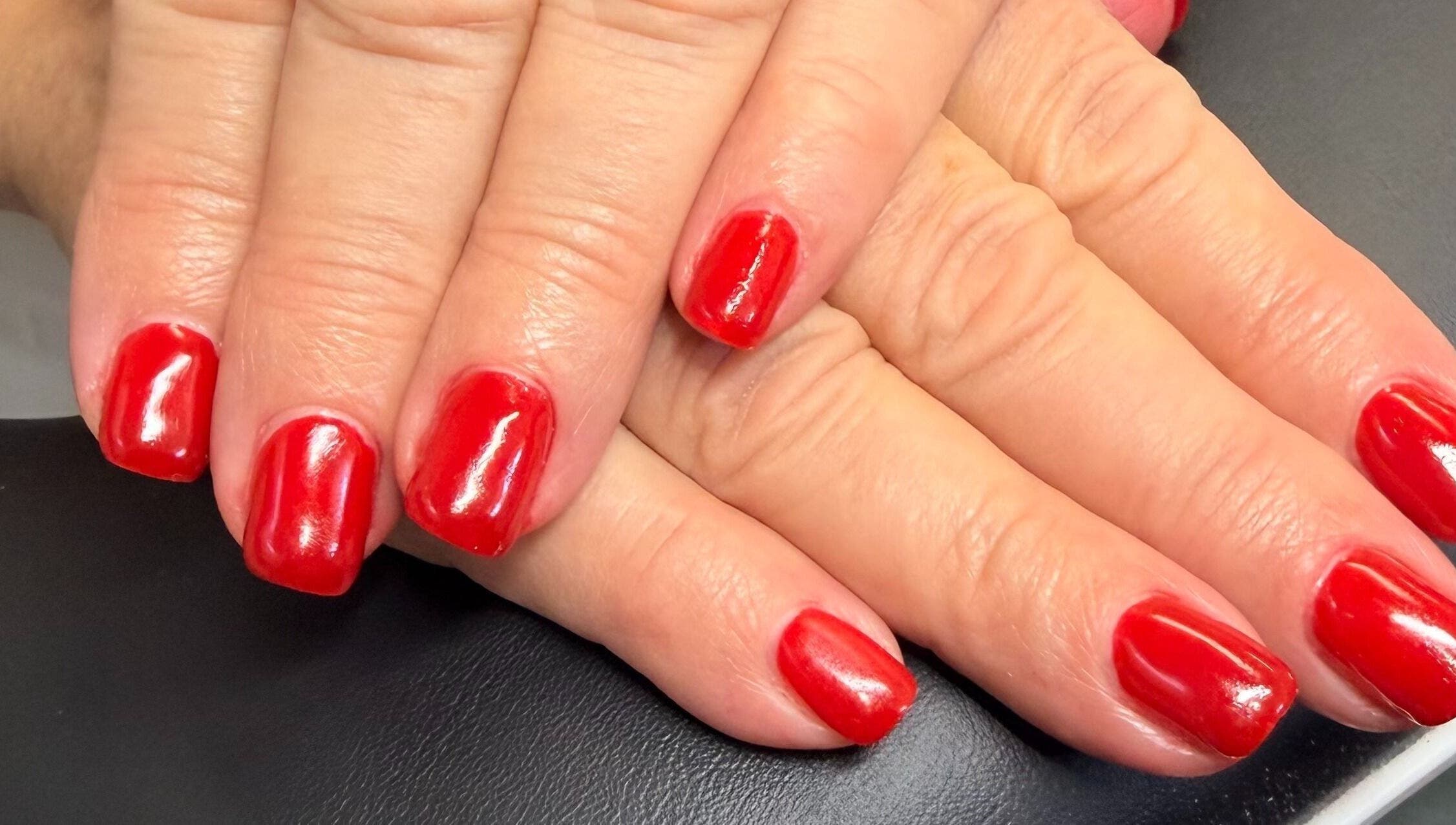 Stunning red manicure by Nails by Nancy @ Linda's Place in Sandy, Utah, US. Perfectly polished nails.