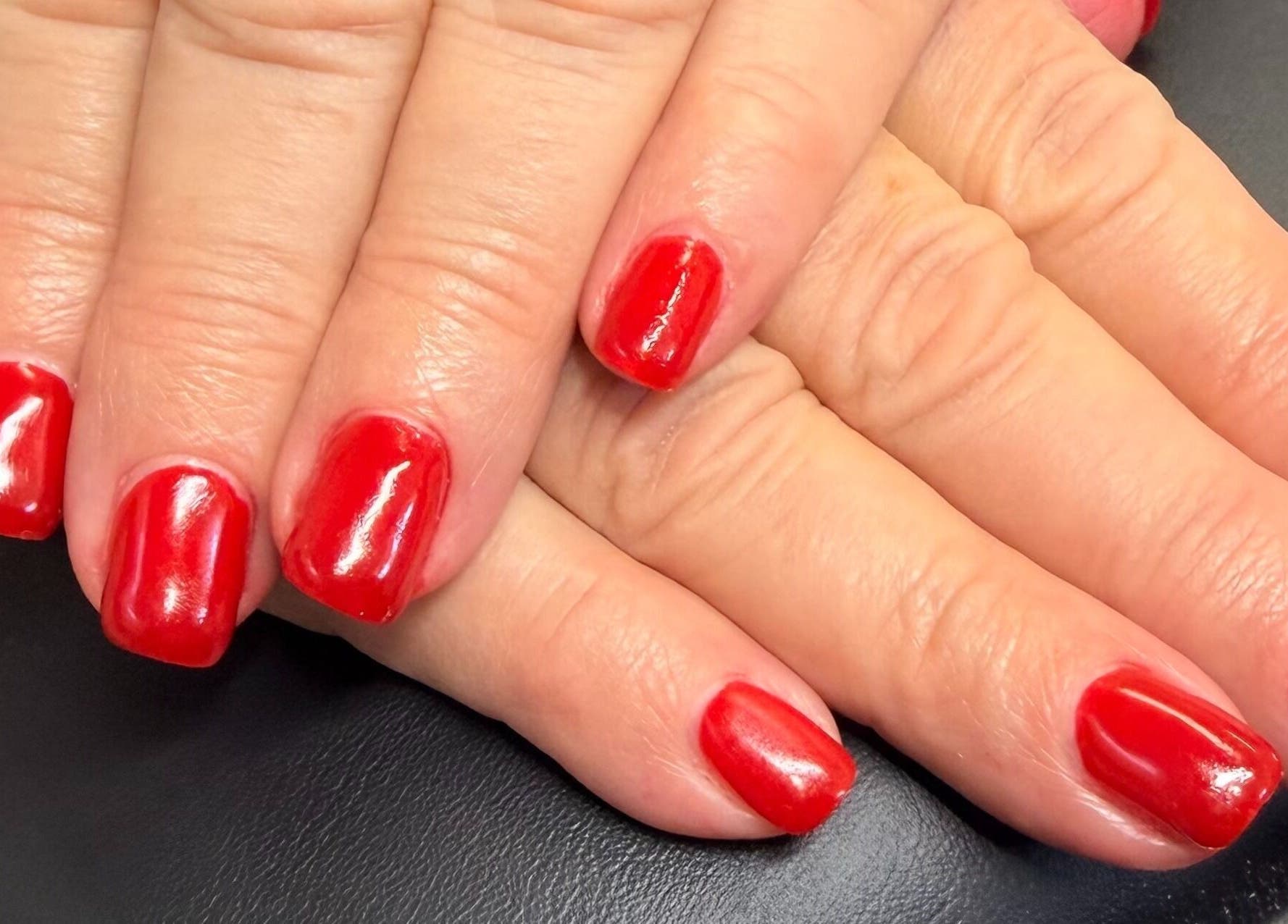 Stunning red manicure by Nails by Nancy @ Linda's Place in Sandy, Utah, US. Perfectly polished nails.