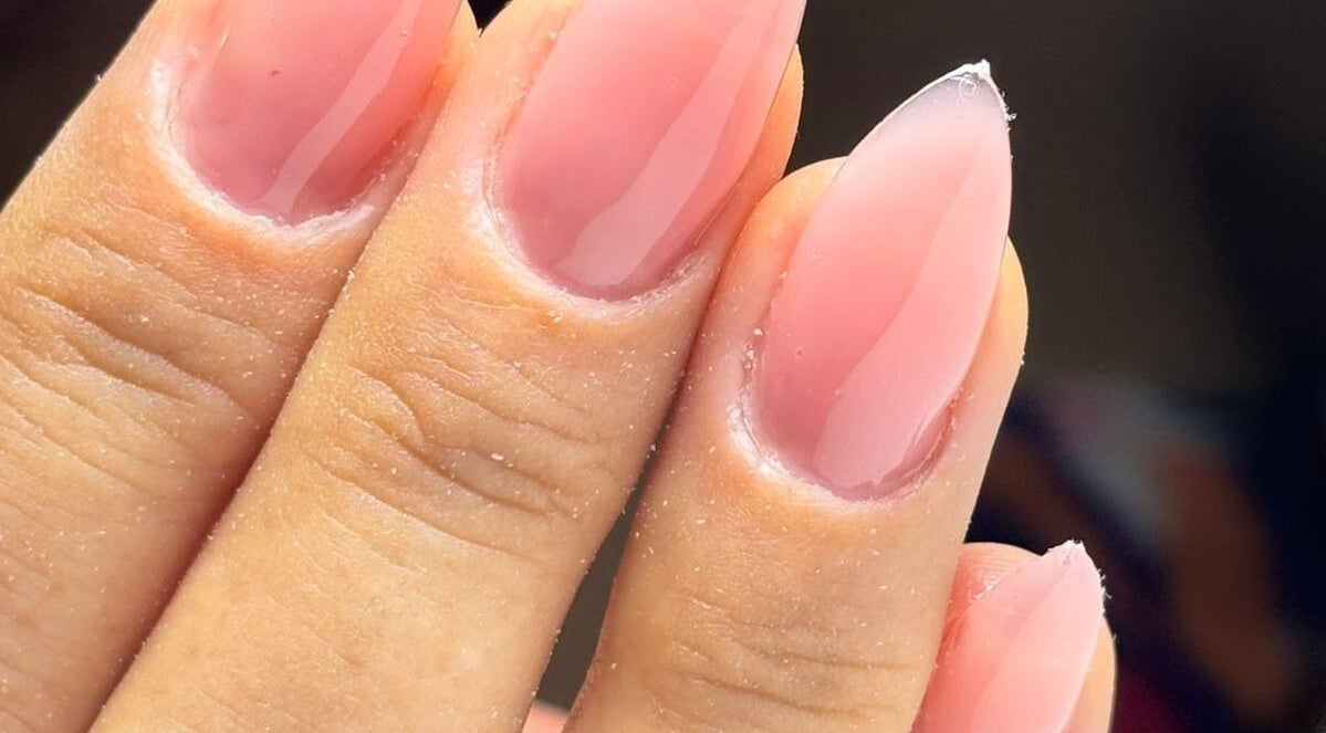 Glossy pink manicure at Nama Nails, Zapopan, Jalisco, MX showcases expert nail artistry.