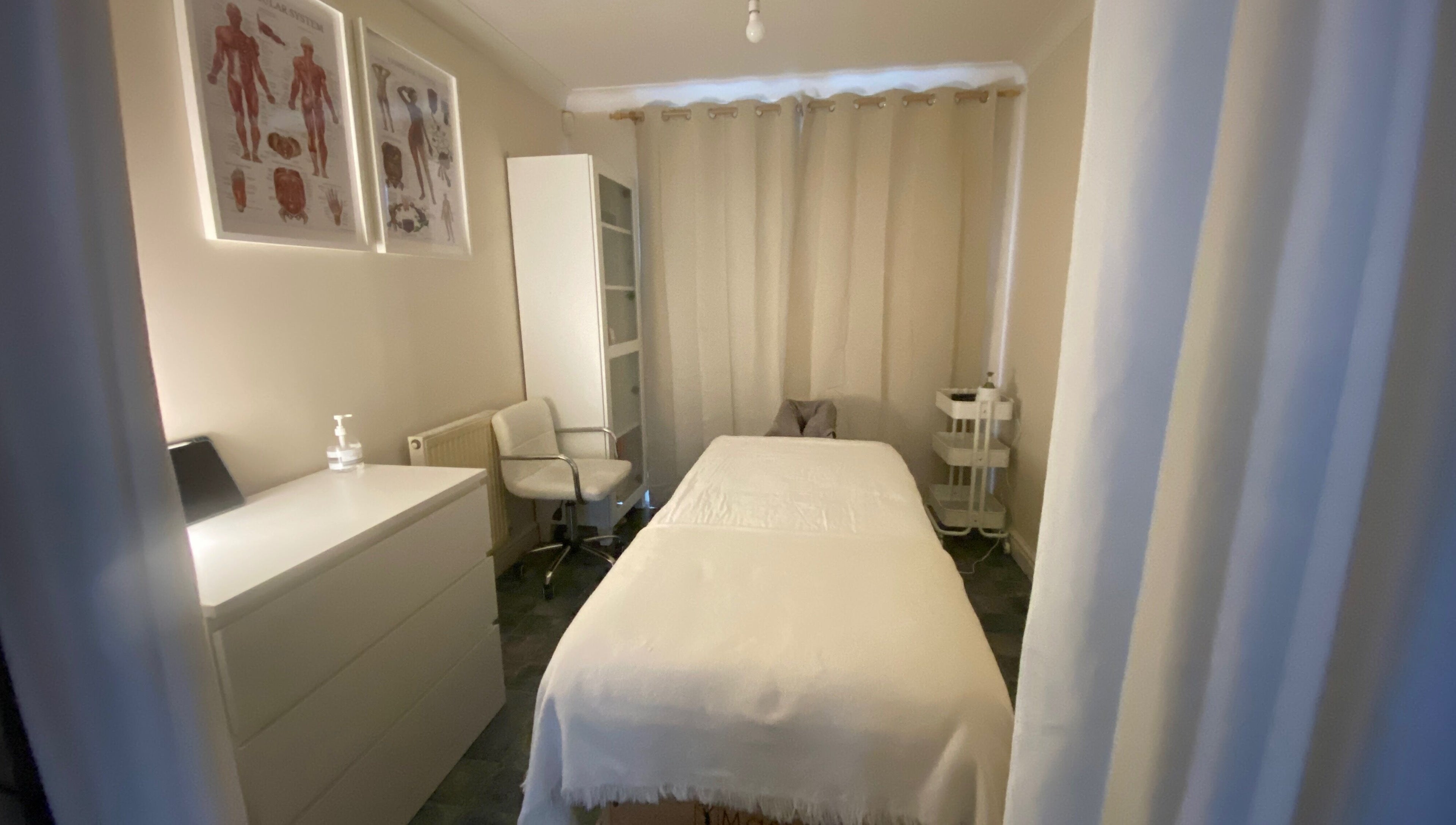 Calm treatment room at Faye Massage & Wellness, Liverpool, England, GB, featuring a massage bed and relaxing decor.